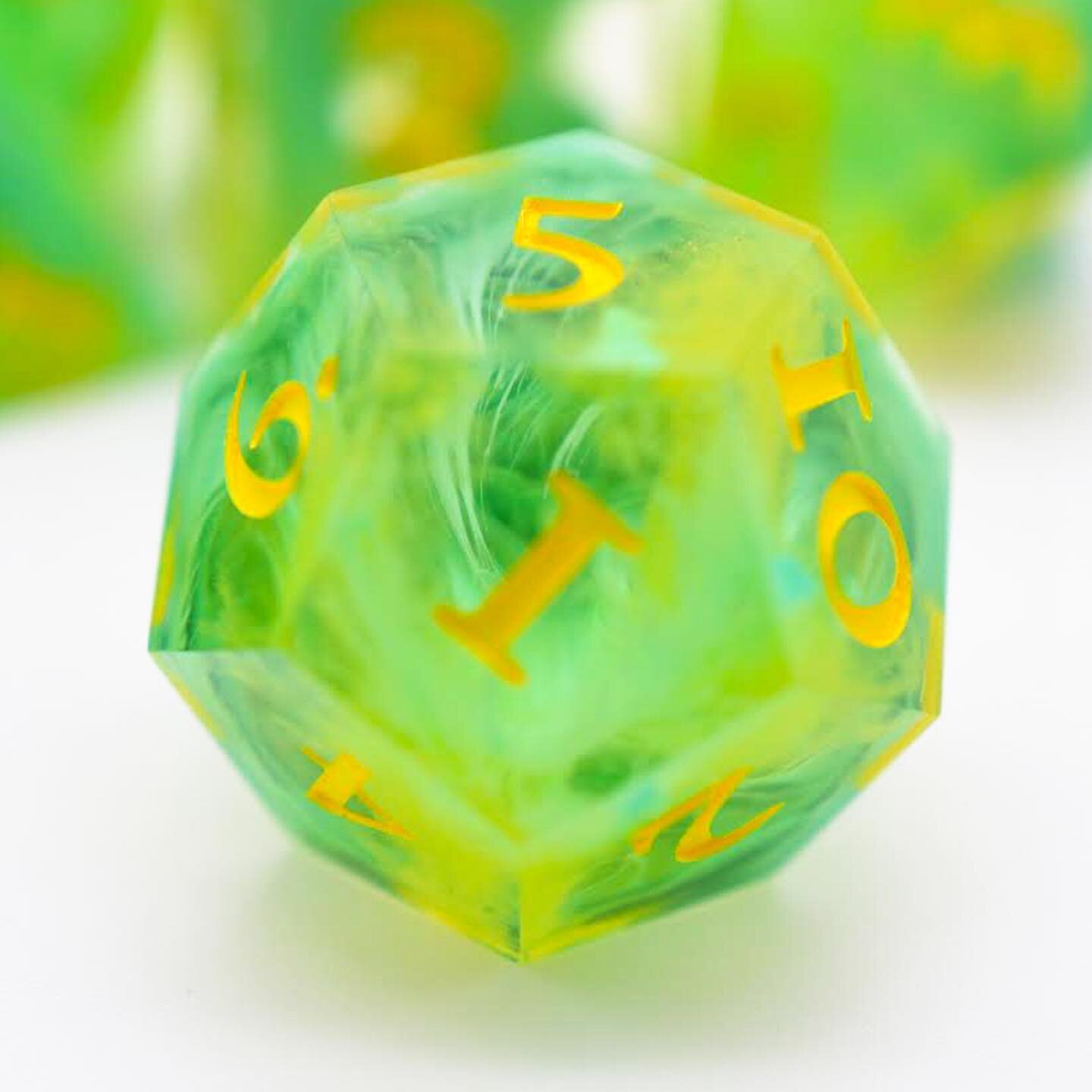 Summer breeze. Inked. 

Teal and yellow cascade through the dice to meet in a pool of teal. 

#dice #handmade #diceset #resin #dicelove #handmadedice #handmadewithlove #pathfinder #diceporn #rpgdice #dnd #dungeonsanddragons #ttrpg #d20  #alumilite #s