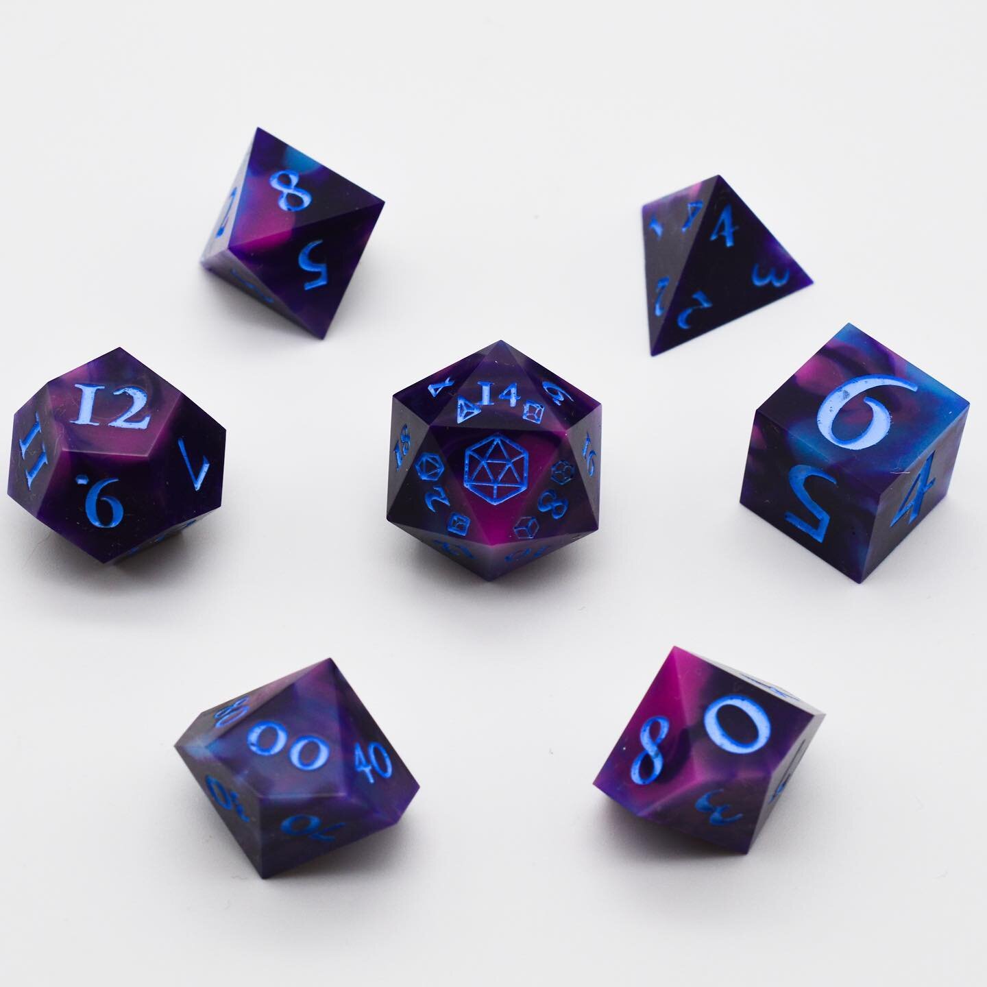 Black magic, but make it pale blue. Full set. 

Swirls of pink, dark purple, and pale blue come together to make this set. 

#dice #handmade #diceset #resin #diceporn #magic #handmadedice #handmadewithlove #pathfinder #diceaddict #rpgdice #dnd #dunge