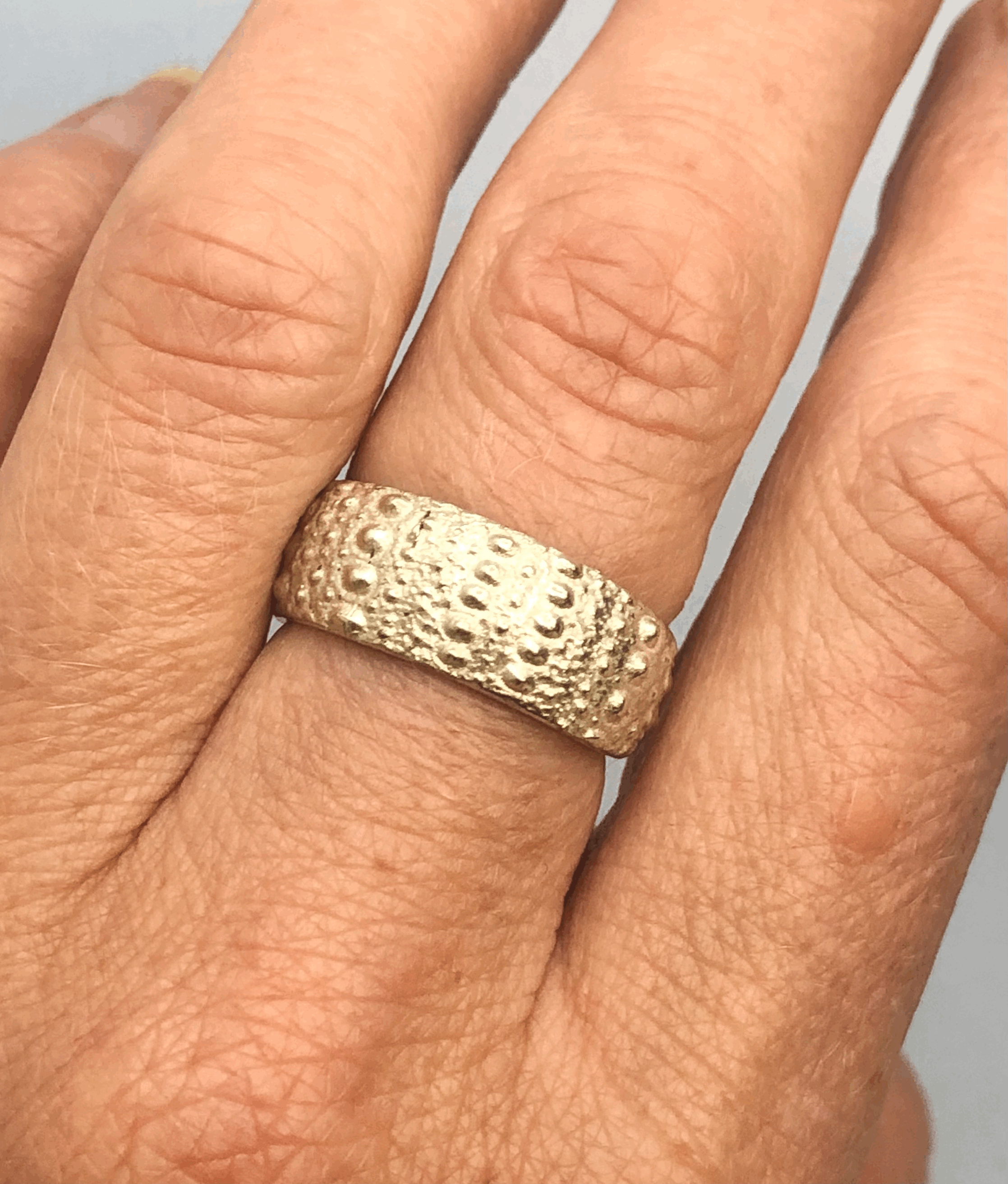 Kina silver ring worn on finger showing fit and scale, handcrafted NZ jewellery