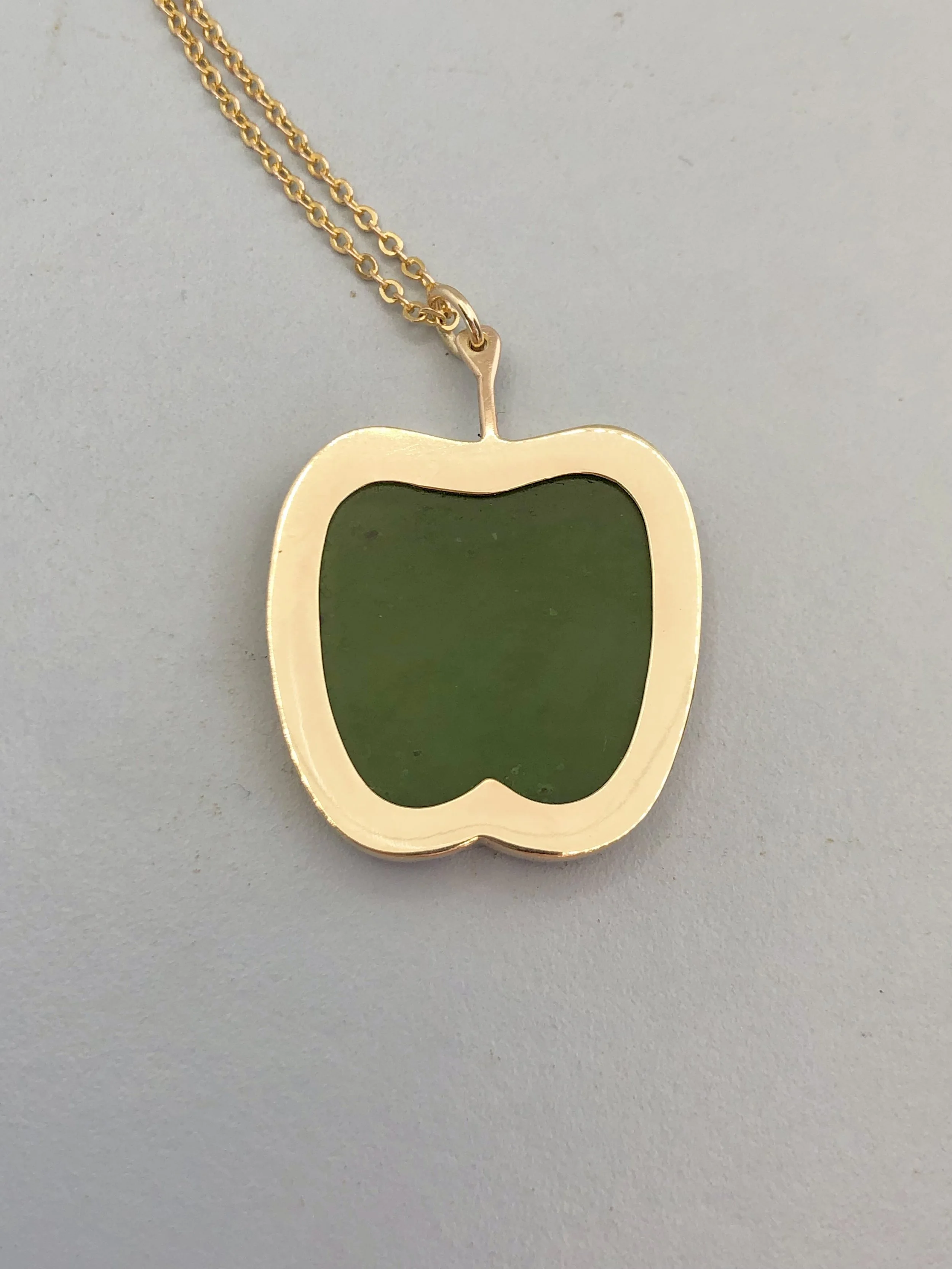 Reverse view of 9k gold & pounamu apple pendant