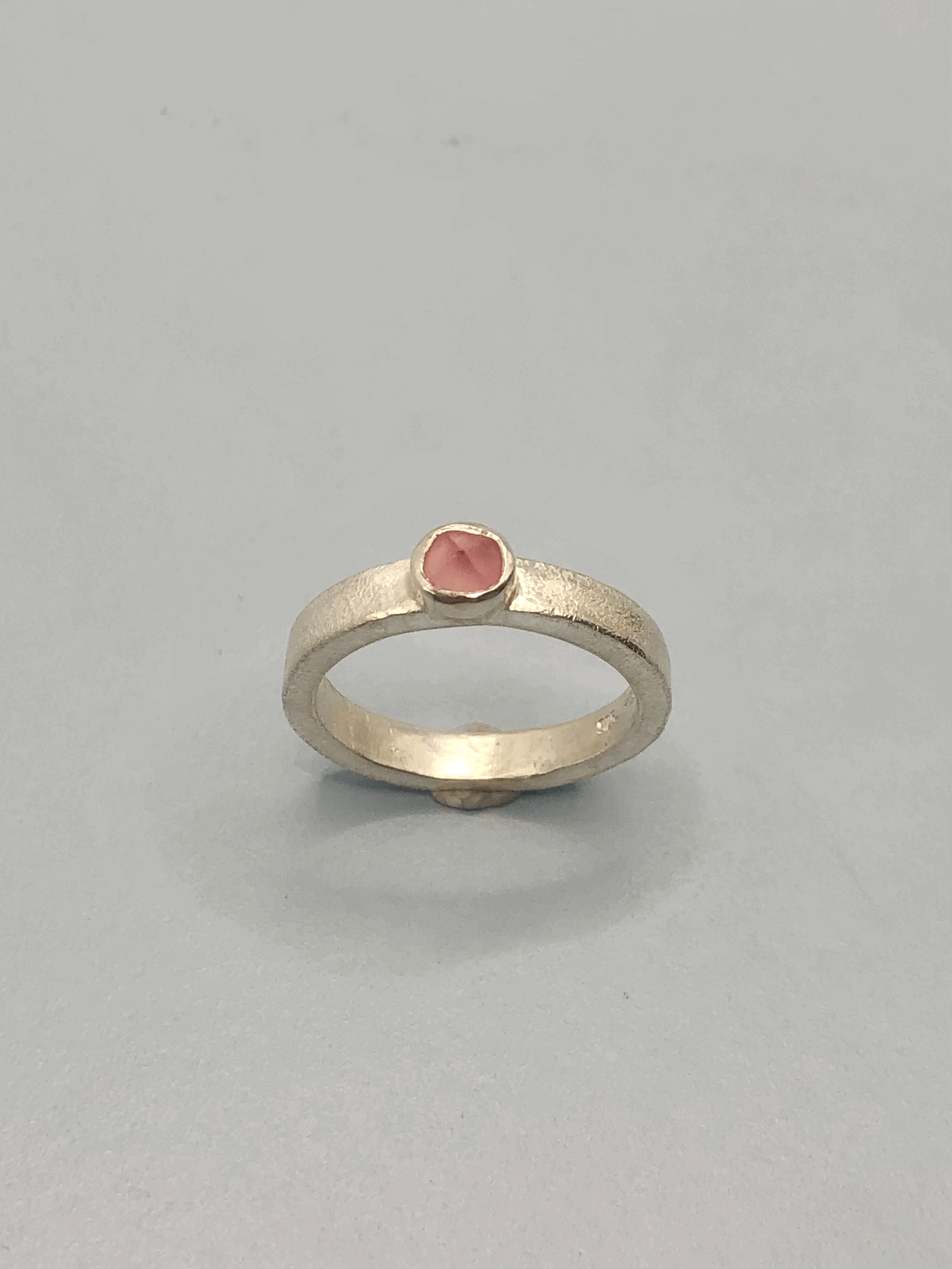 Pink tourmaline sterling silver stacker ring showing delicate 3.5mm band width