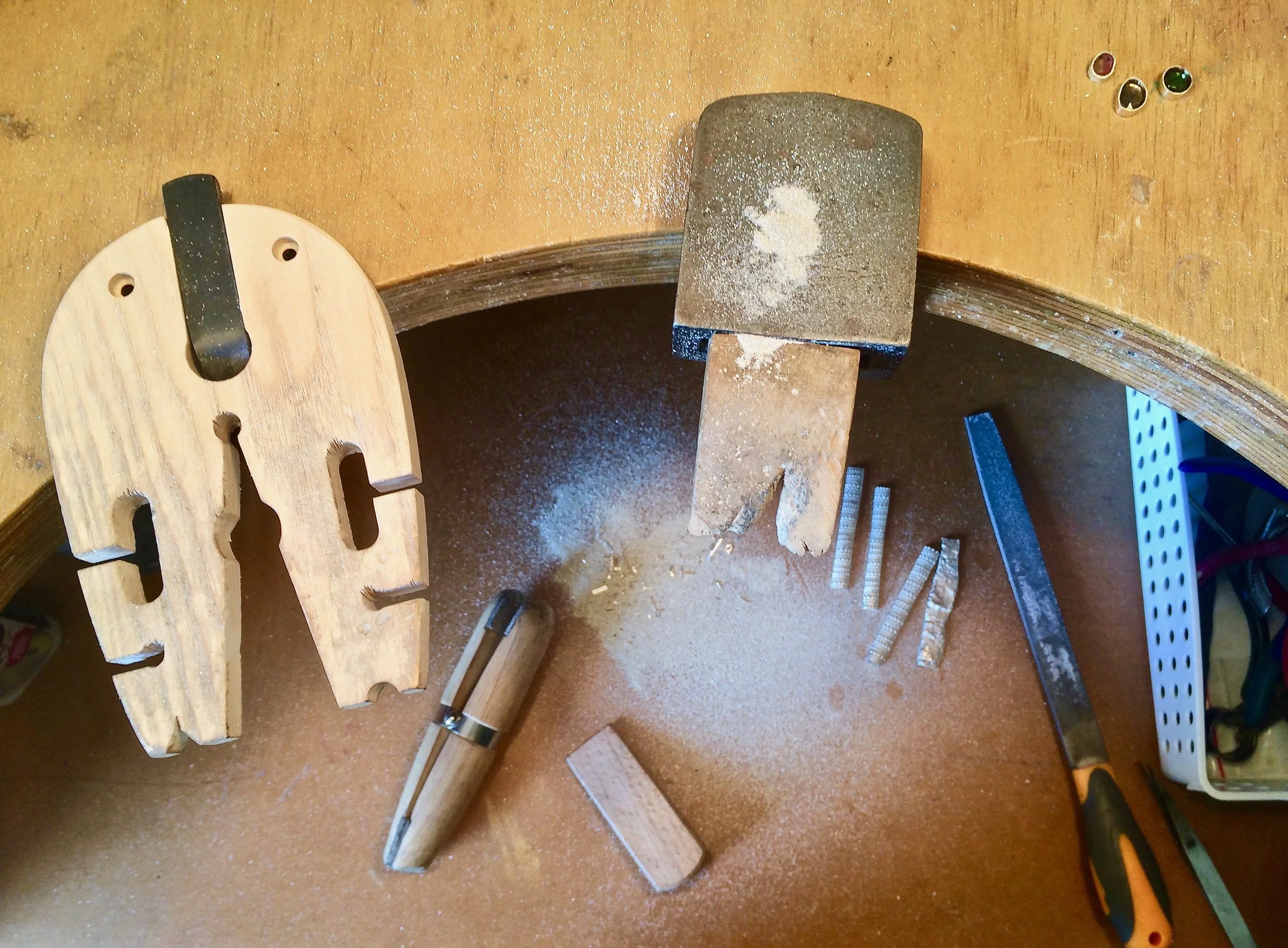 A well-equipped jewellery making workshop bench laid out with tools, ready for a silversmithing class at The Factory Workshop in Tataraimaka, Taranaki.