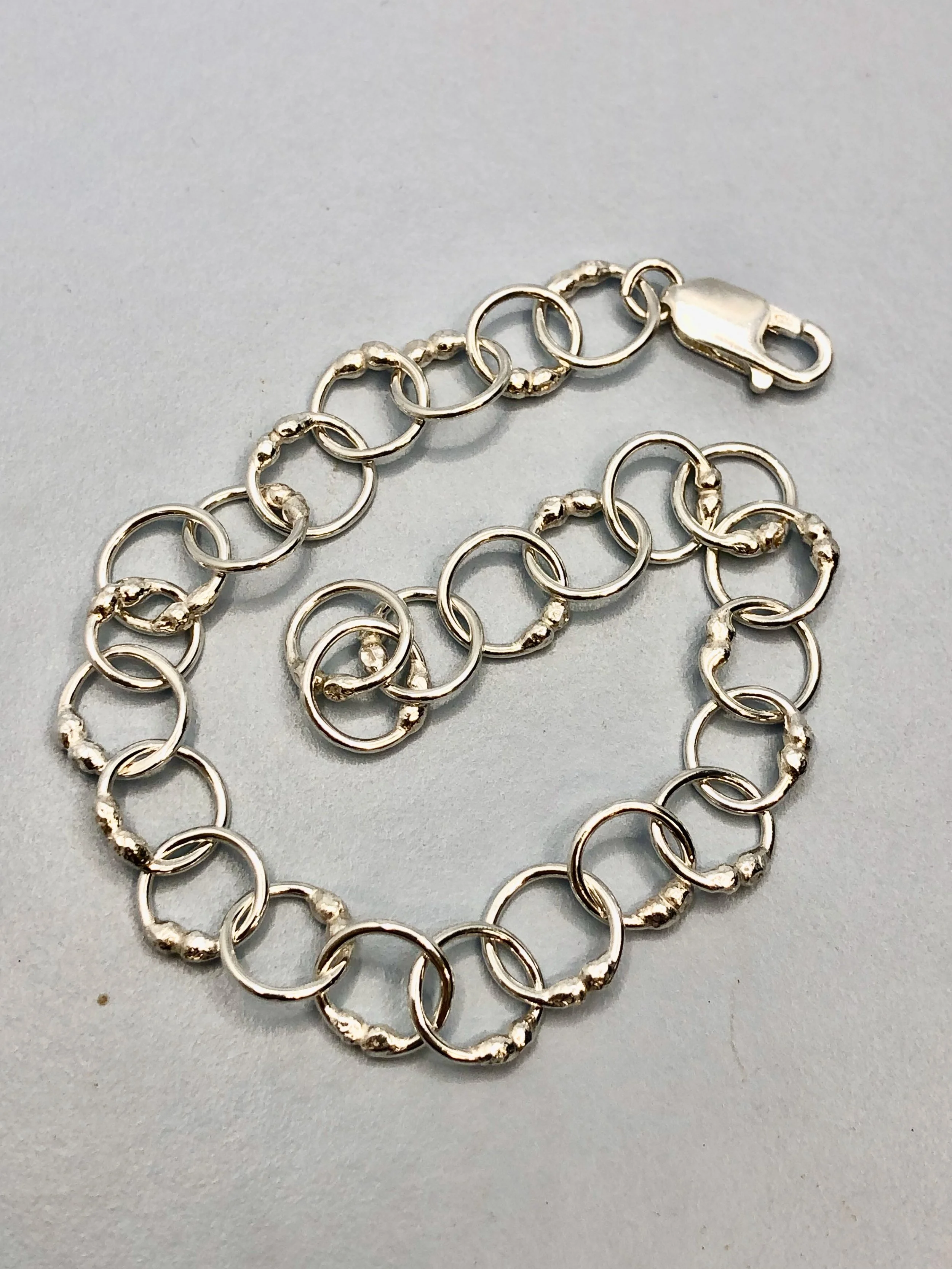 Close-up of sterling silver ball-link chain detail