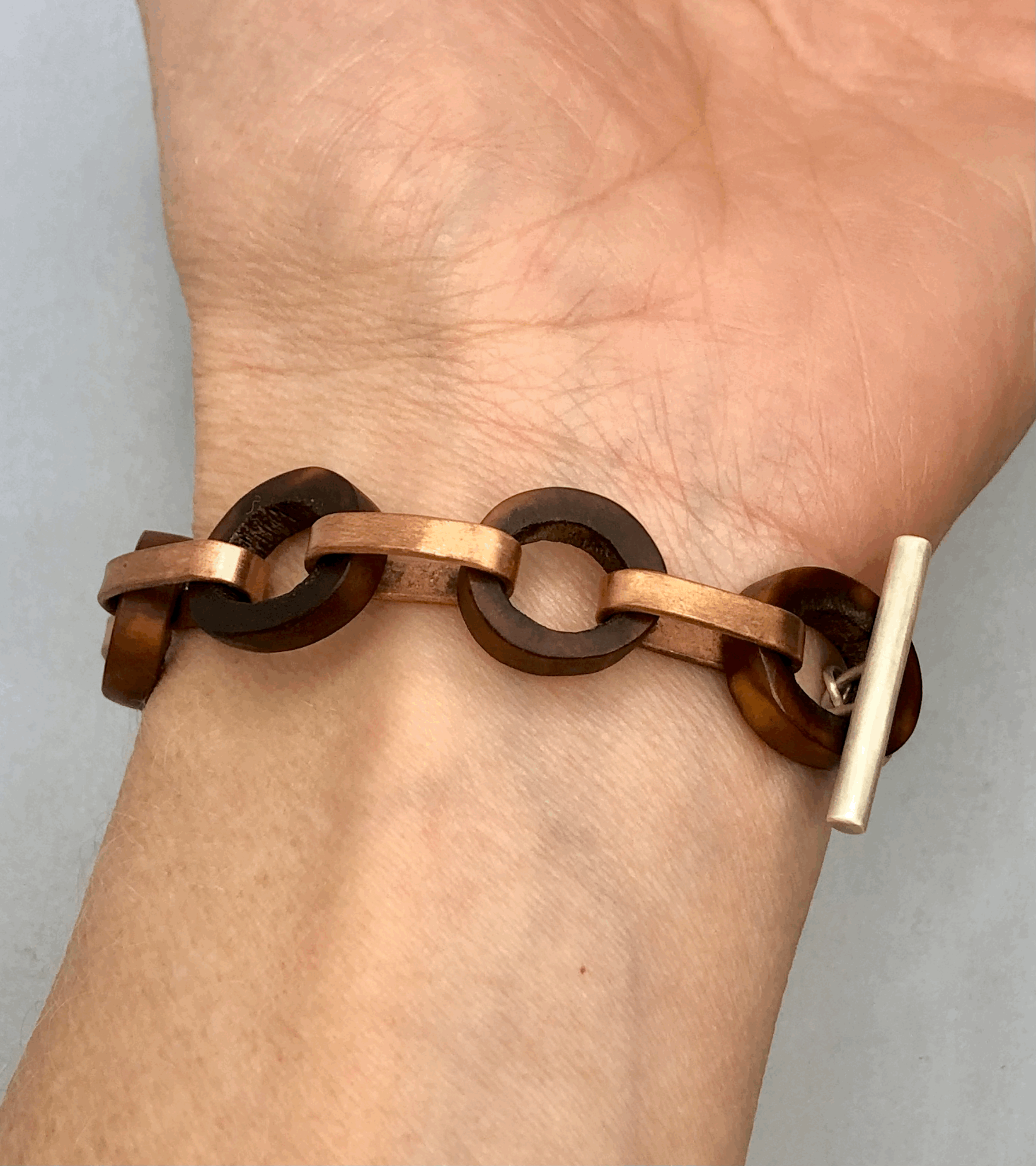 Rachel Lambert antler and copper bracelet worn on wrist showing 21cm length and lightweight fit
