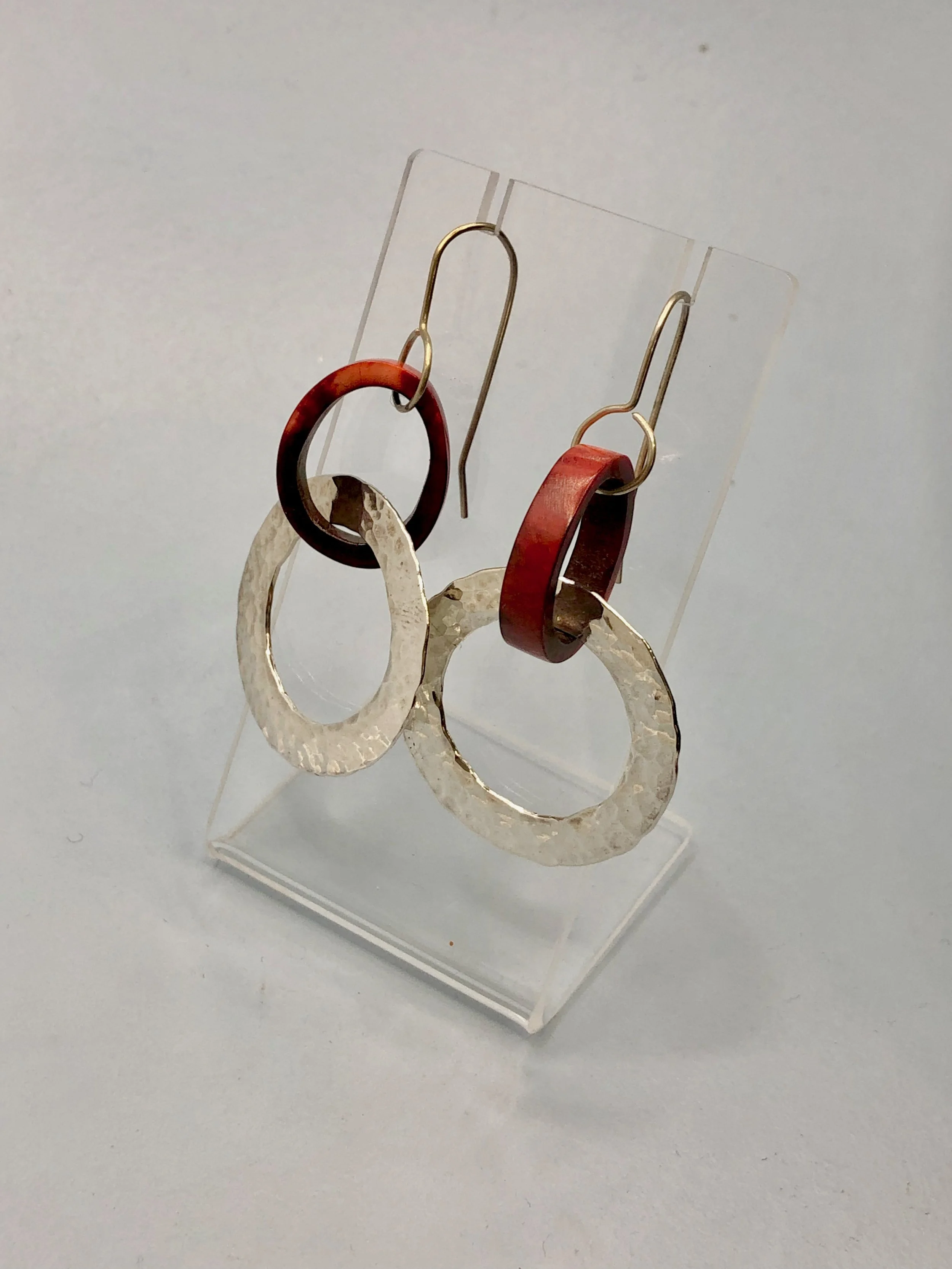 Side view of dyed antler and textured silver hoops