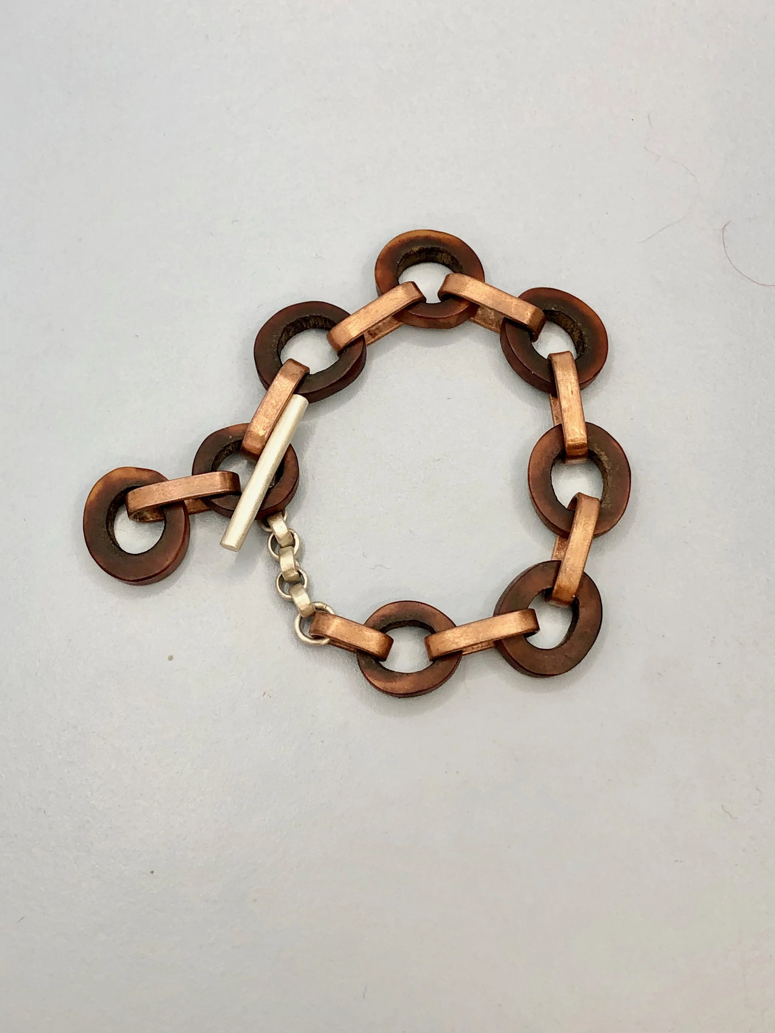 Antler, copper and sterling silver bracelet shown attached at second link