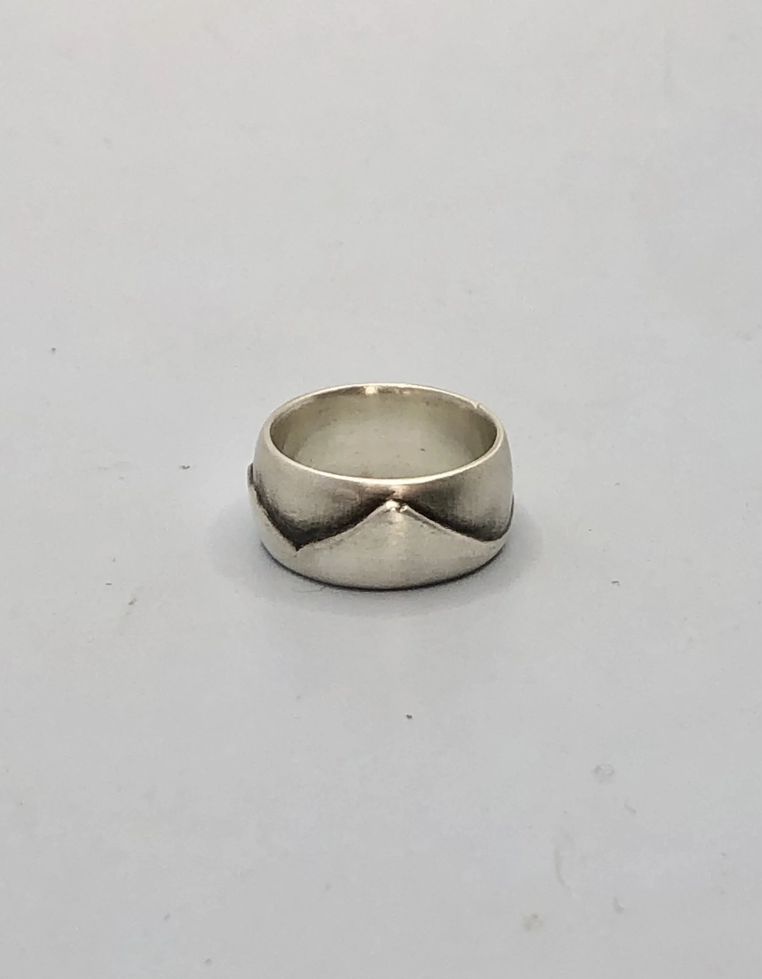 Detail of lost-wax cast sterling silver Taranaki ranges ring, handcrafted NZ jewellery by Rachel Lambert
