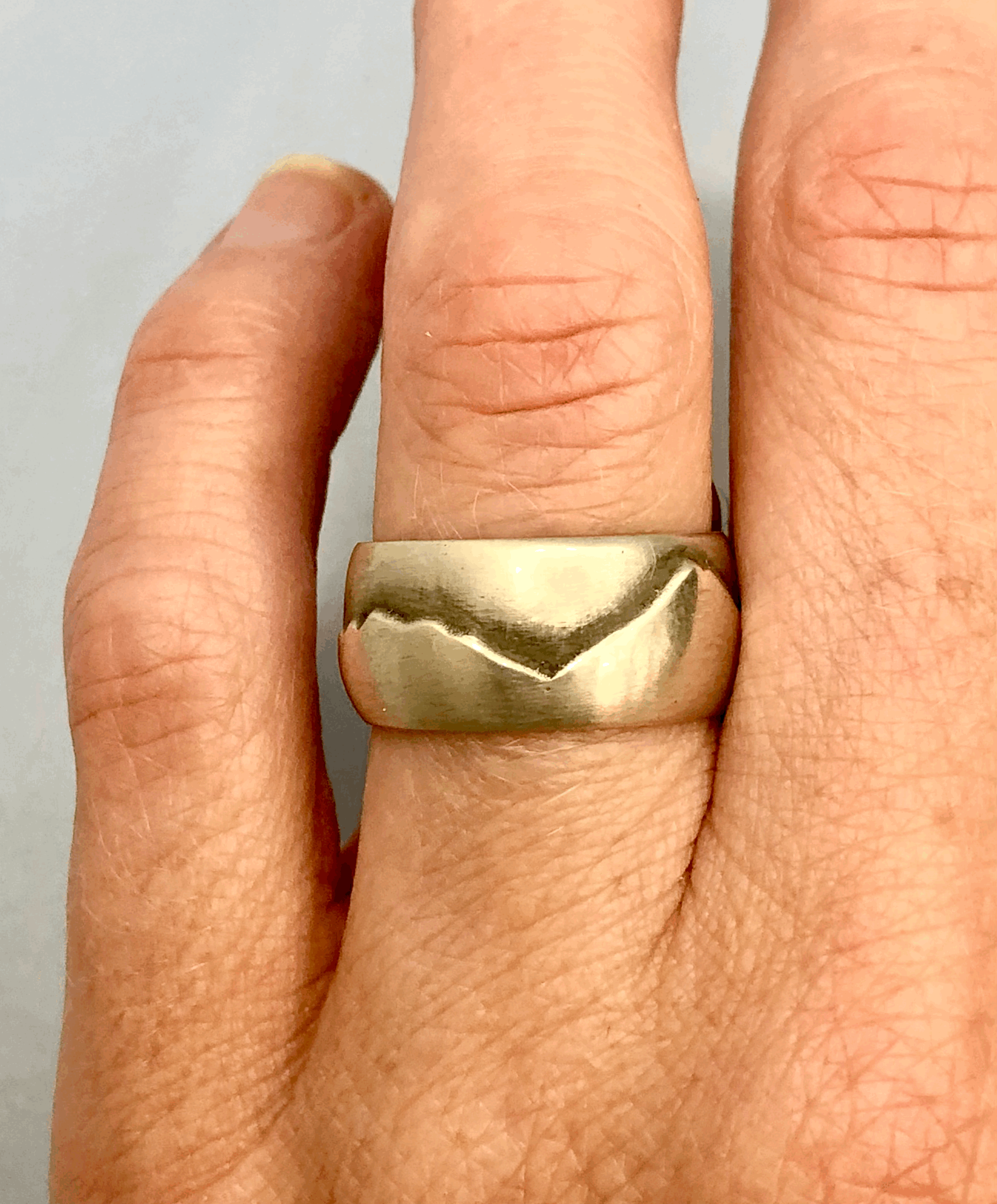 Taranaki ranges silver ring worn on finger showing fit and bold 12mm width, size M