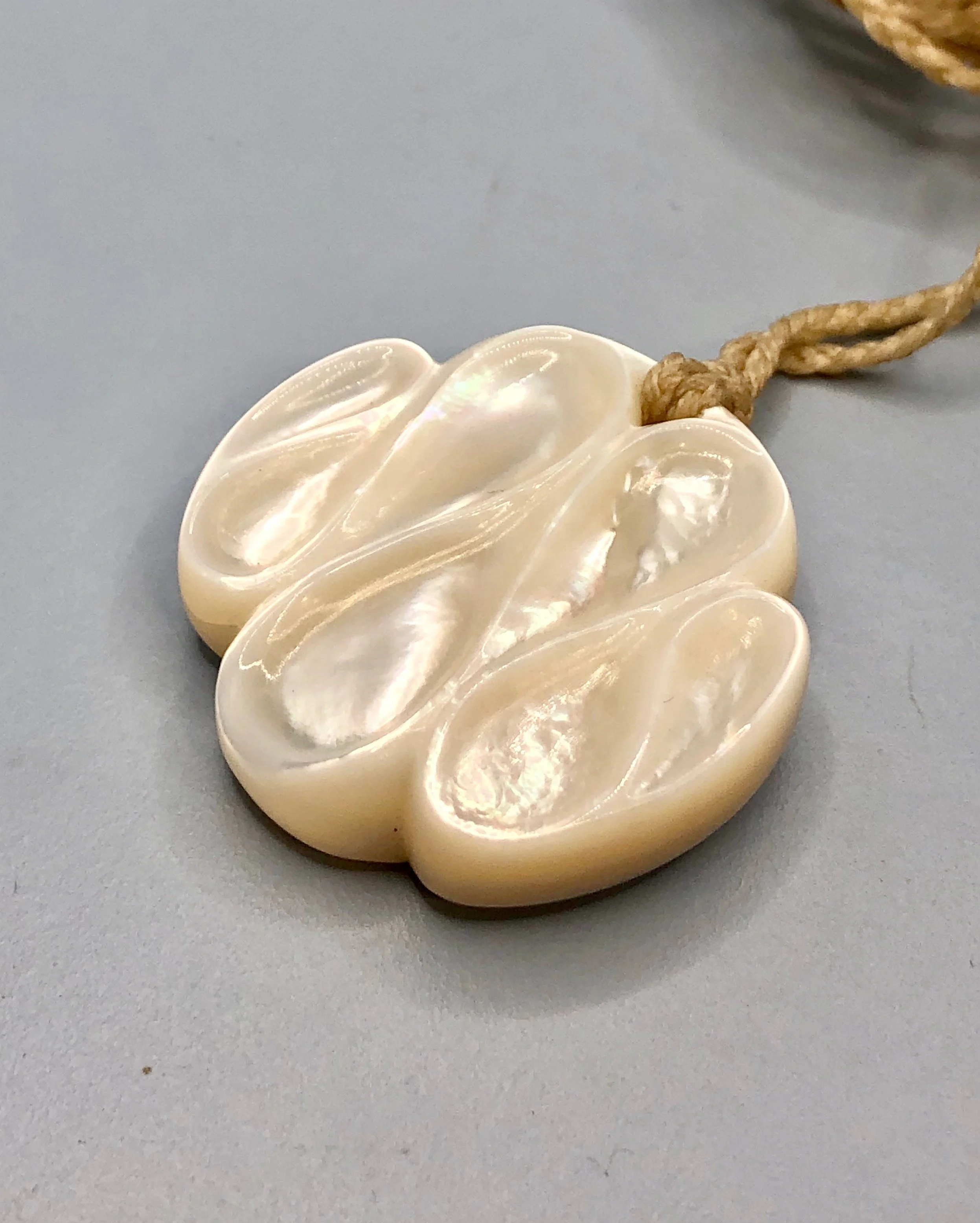 Close-up of the front from low angle to show the depth of the pearl shell