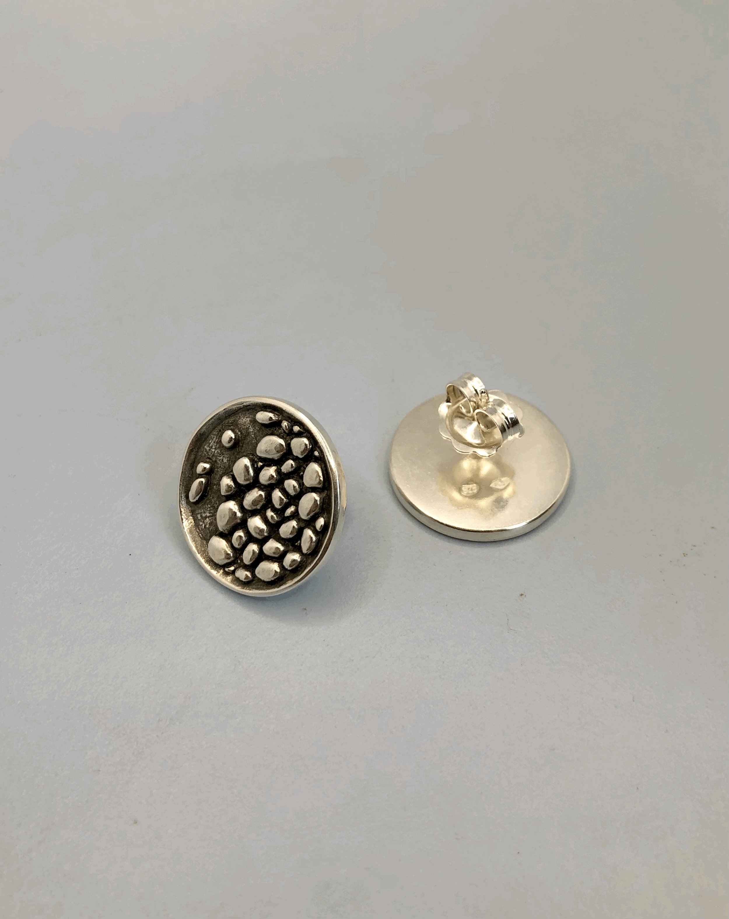Sterling silver stony river studs showing front and back view with butterfly