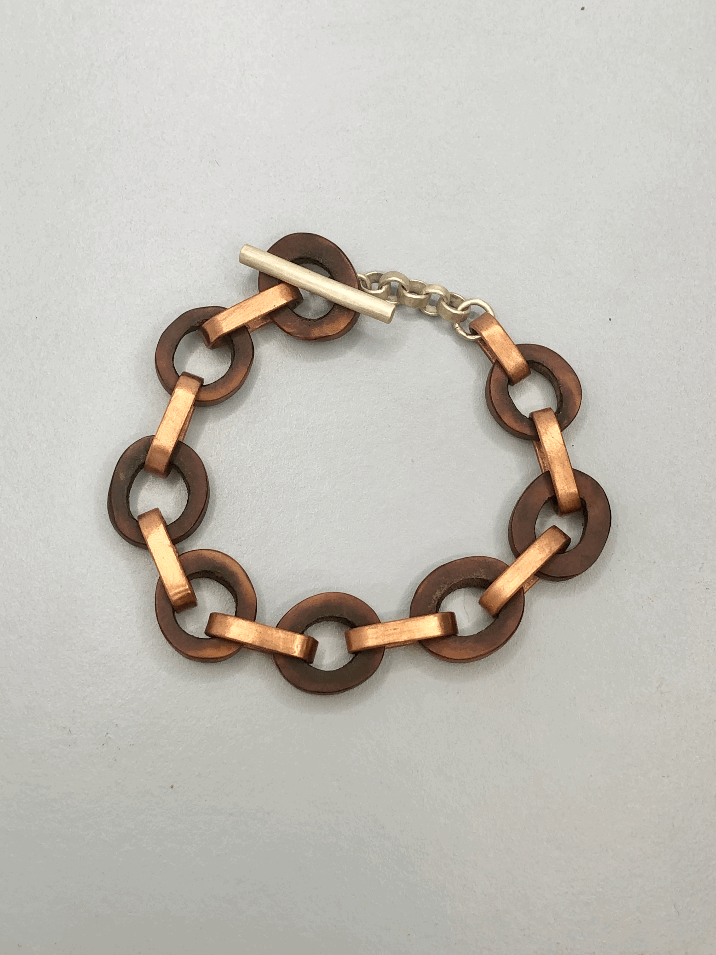 Hand-cut naturally dyed antler bracelet with copper links and sterling silver clasp by Rachel Lambert Jewellery