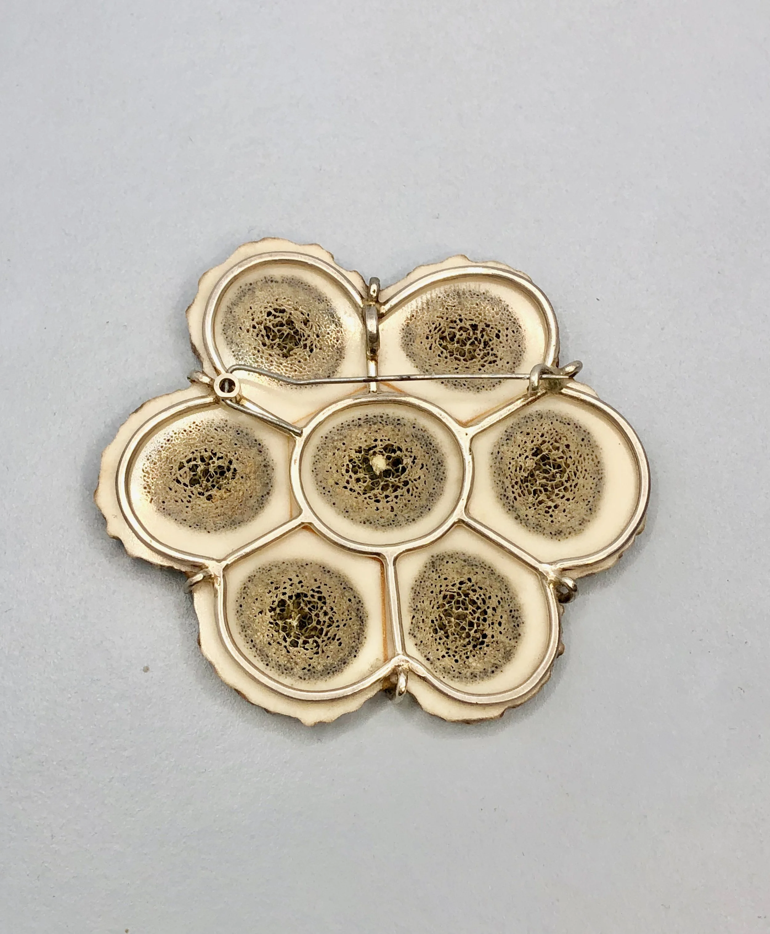 Reverse view of antler flower brooch to show the sterling silver brooch frame