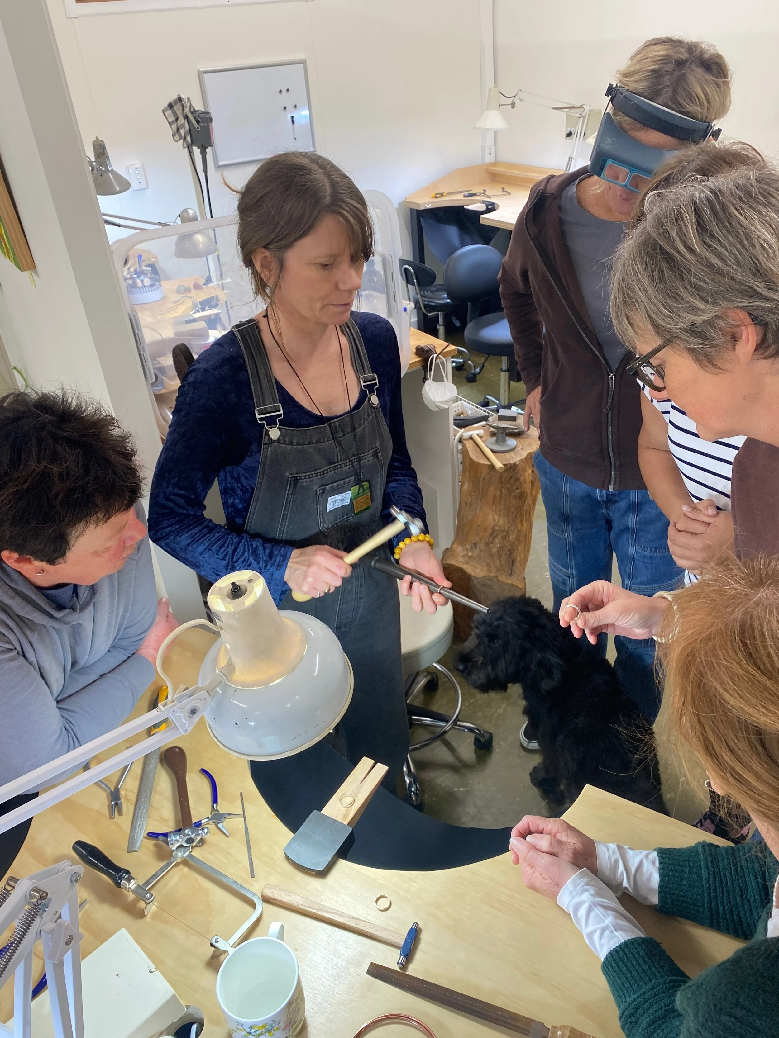 Me teaching a group of women in a textured ring making class.