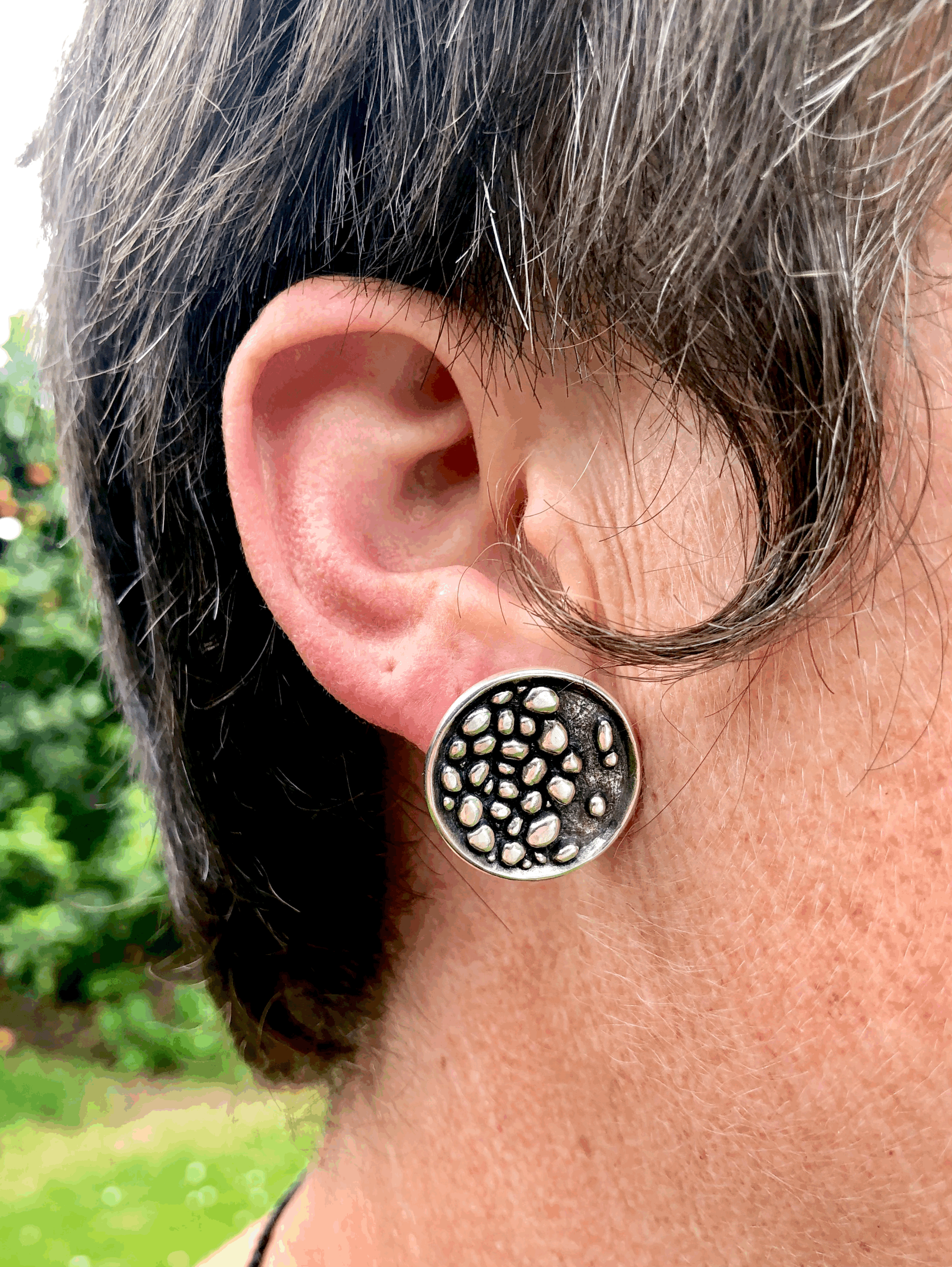 Stony riverbed studs shown being worn