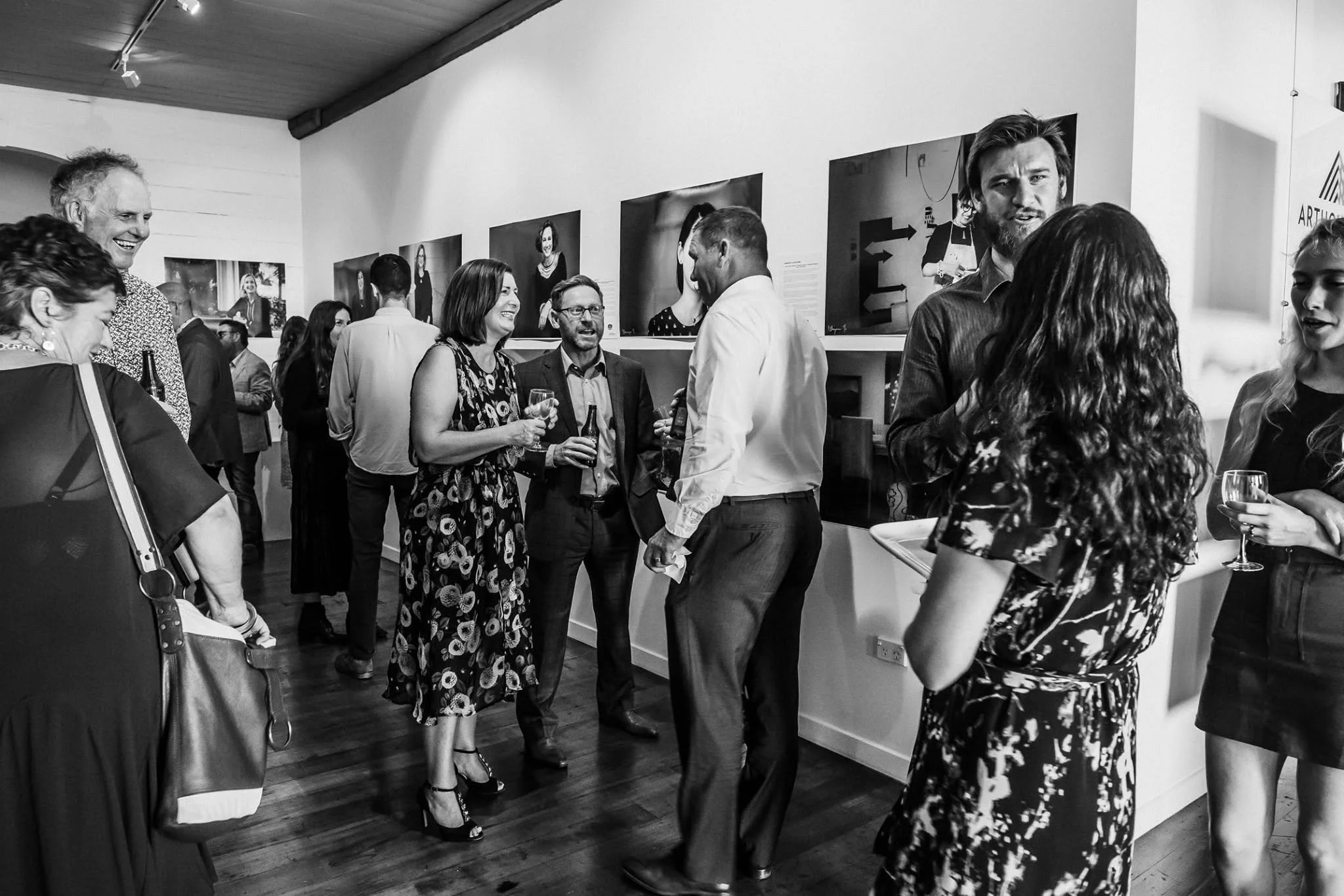 Guests enjoying their night at the 'My Jens Hansen' photo exhibition.