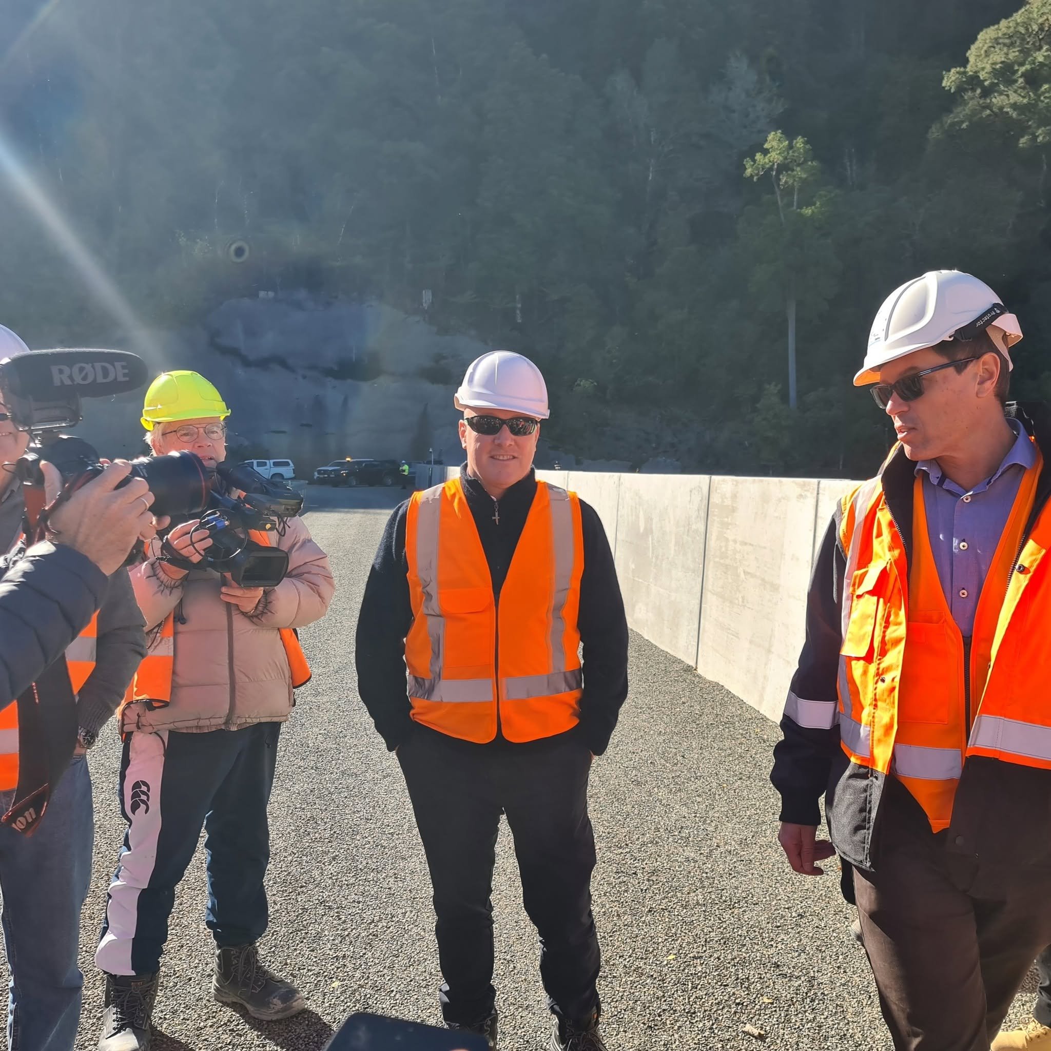 Media follow Prime Minister Rt Hon Christopher Luxon's walk of the Waimea Community Dam's crest with CEO Mike Scott, 9 May 2024, ahead of final completion in 2025