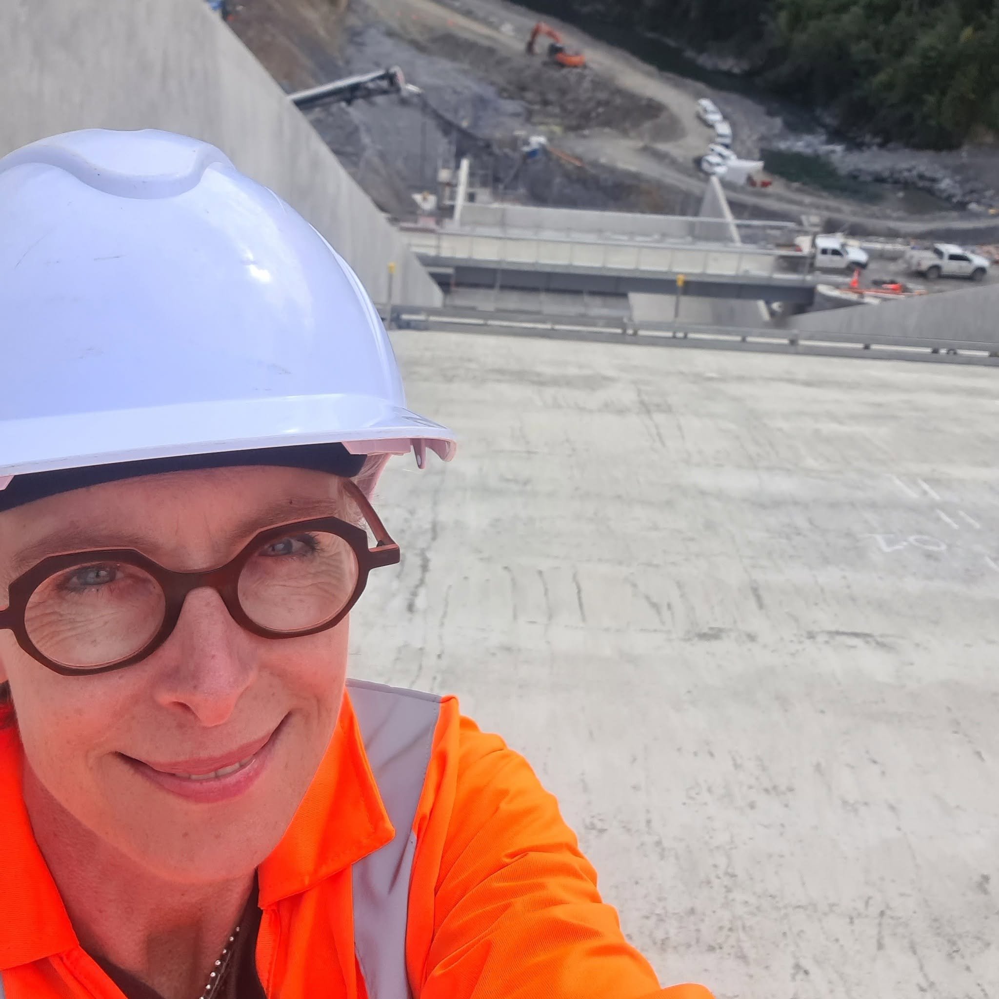 Emma accompanying media on a tour of the Waimea Community Dam  - the last chance to stand on the 165 metre spillway before reservoir water flows down to the river below.