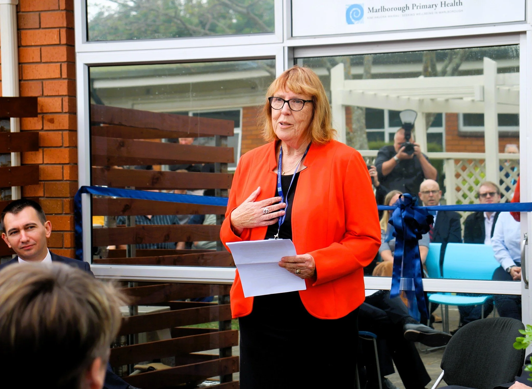 Marlborough Primary Health - CE Beth Tester delivers whaikōrero at the opening of Tātari Toto Haemodialysis Unit. Seated to her left, Health Minister Hon Simeon Brown.