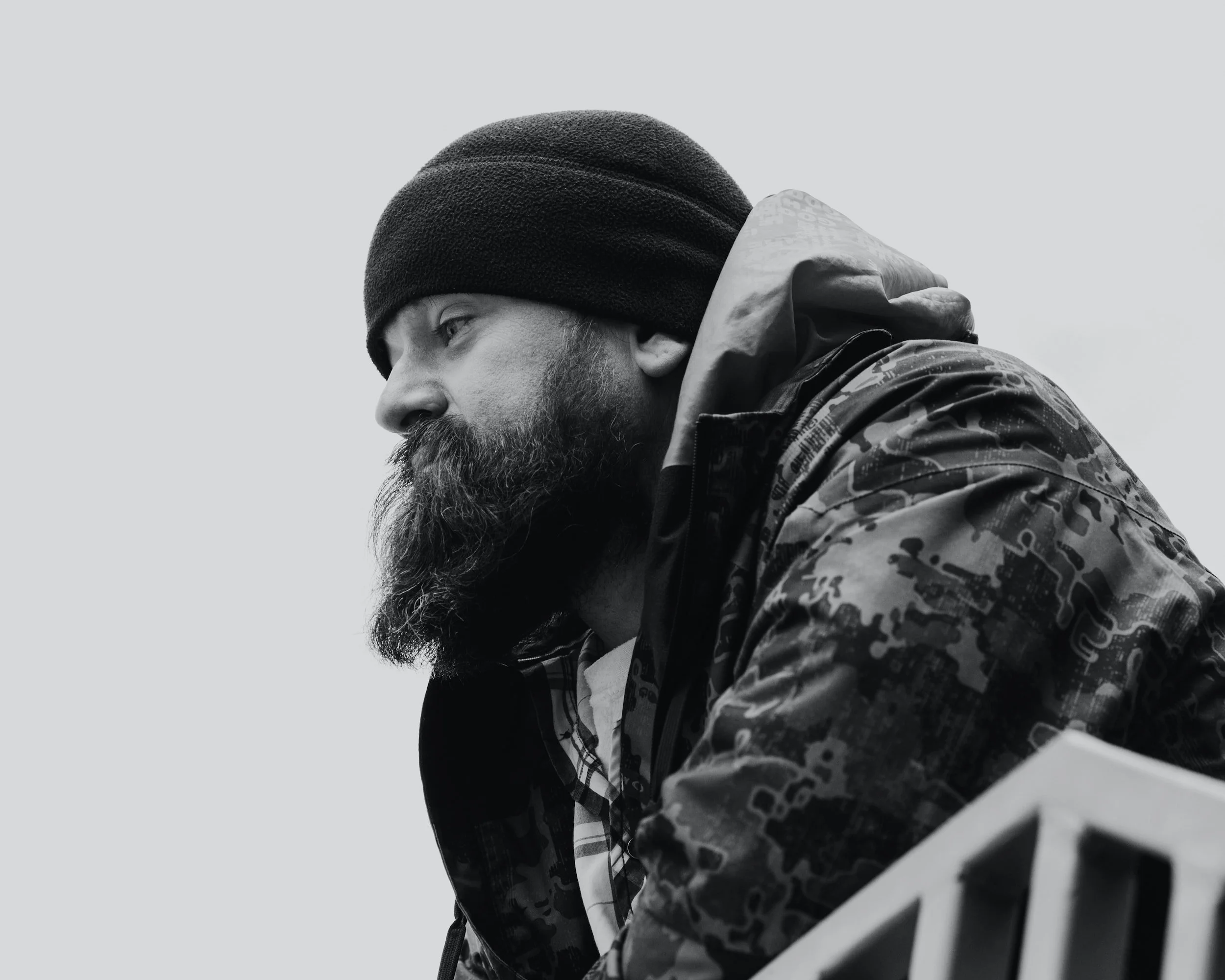 guy with a big beard wearing a jacket feeling depressed transitioning into civilian life, military counseling, counseling for veterans