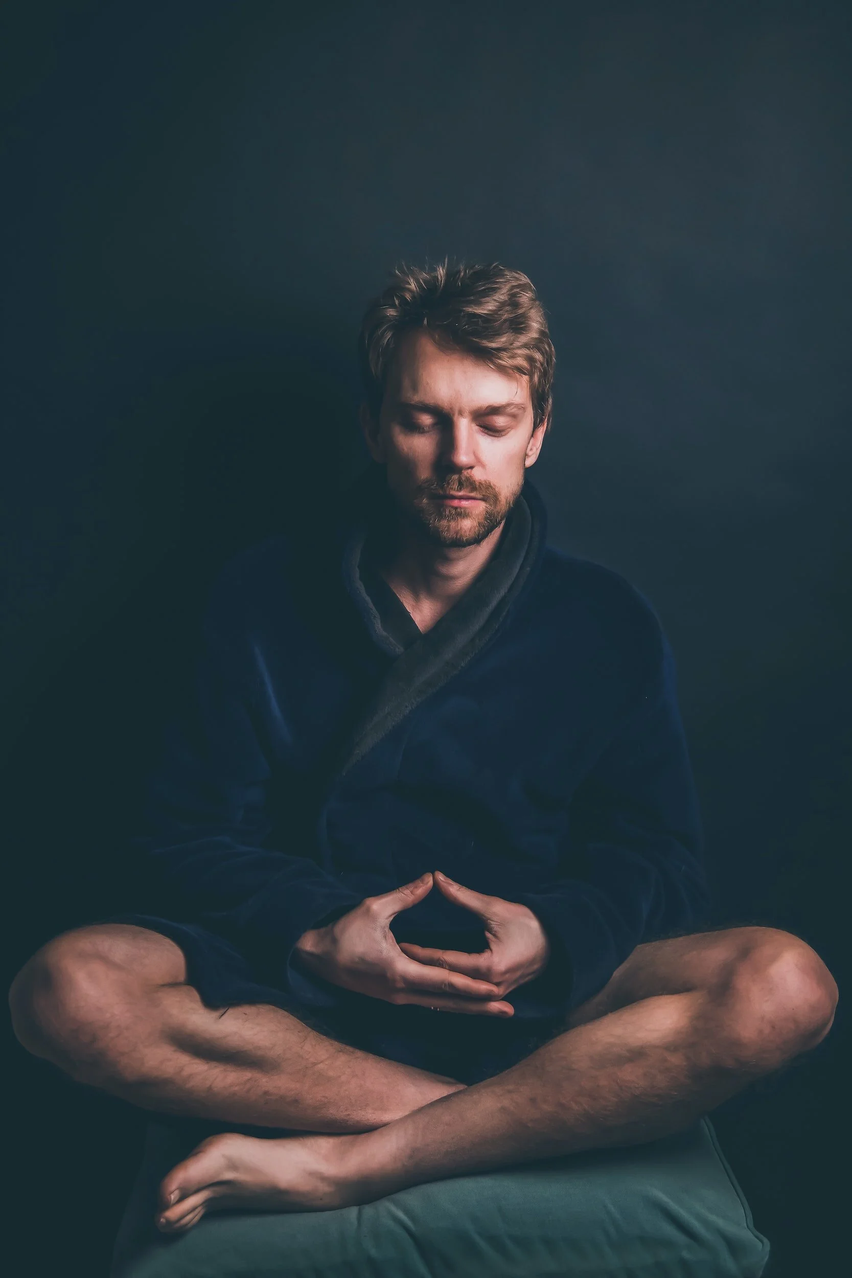 a guy sitting in a robe meditating, counseling for low self esteem, counselor st petersburg, fl