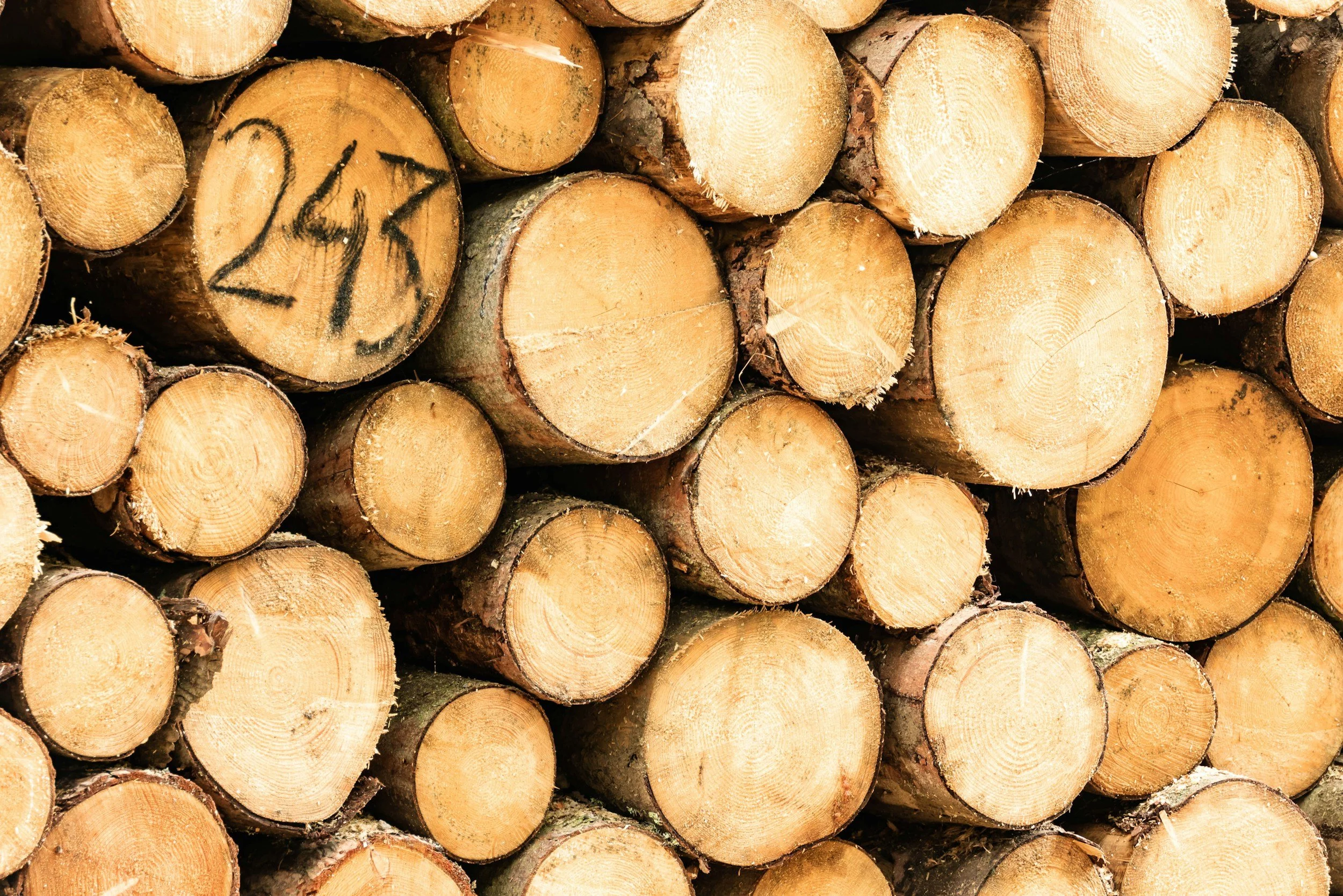 a stack of wood with a number etched in to the bottom of it, angel numbers, what does repeating numbers mean