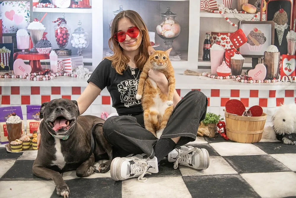 Denver pet sitter being friendly with cats and dogs.