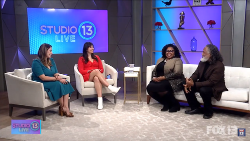 Four women sitting on sofas in a TV studio with a 'Studio 13 Live' sign in the background discussing.