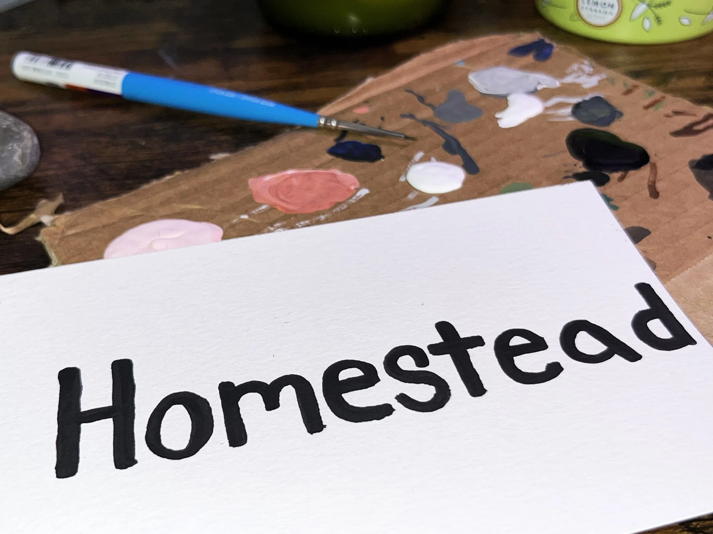 Using acrylic paint and Photoshop to create Homestead’s logo