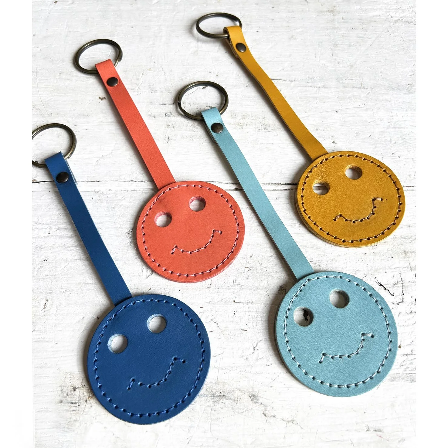 4 smiley faces smooth.jpg