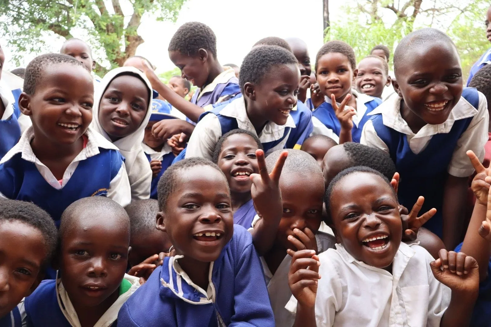 A group of school kids laughing.