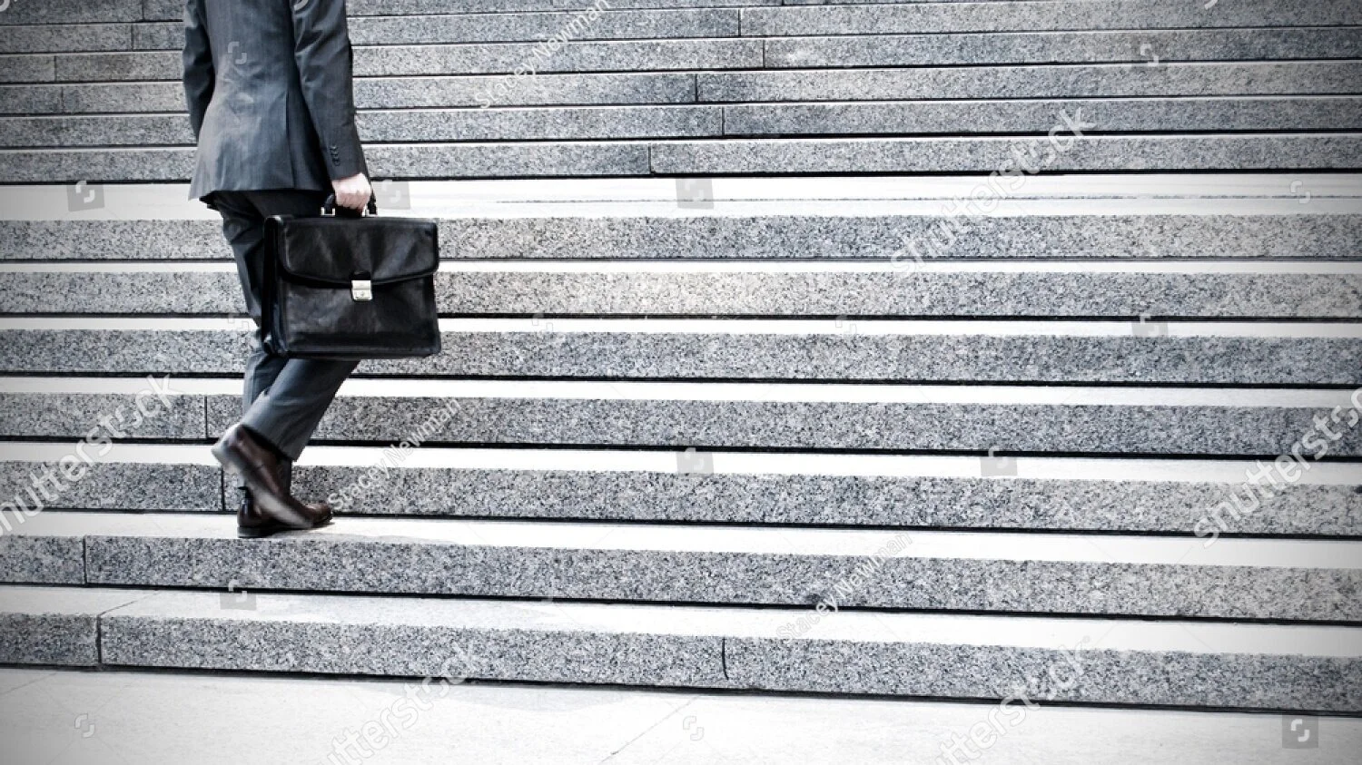 stock-photo-corporate-briefcase-suit-steps-to-skyscraper-171934772.jpg