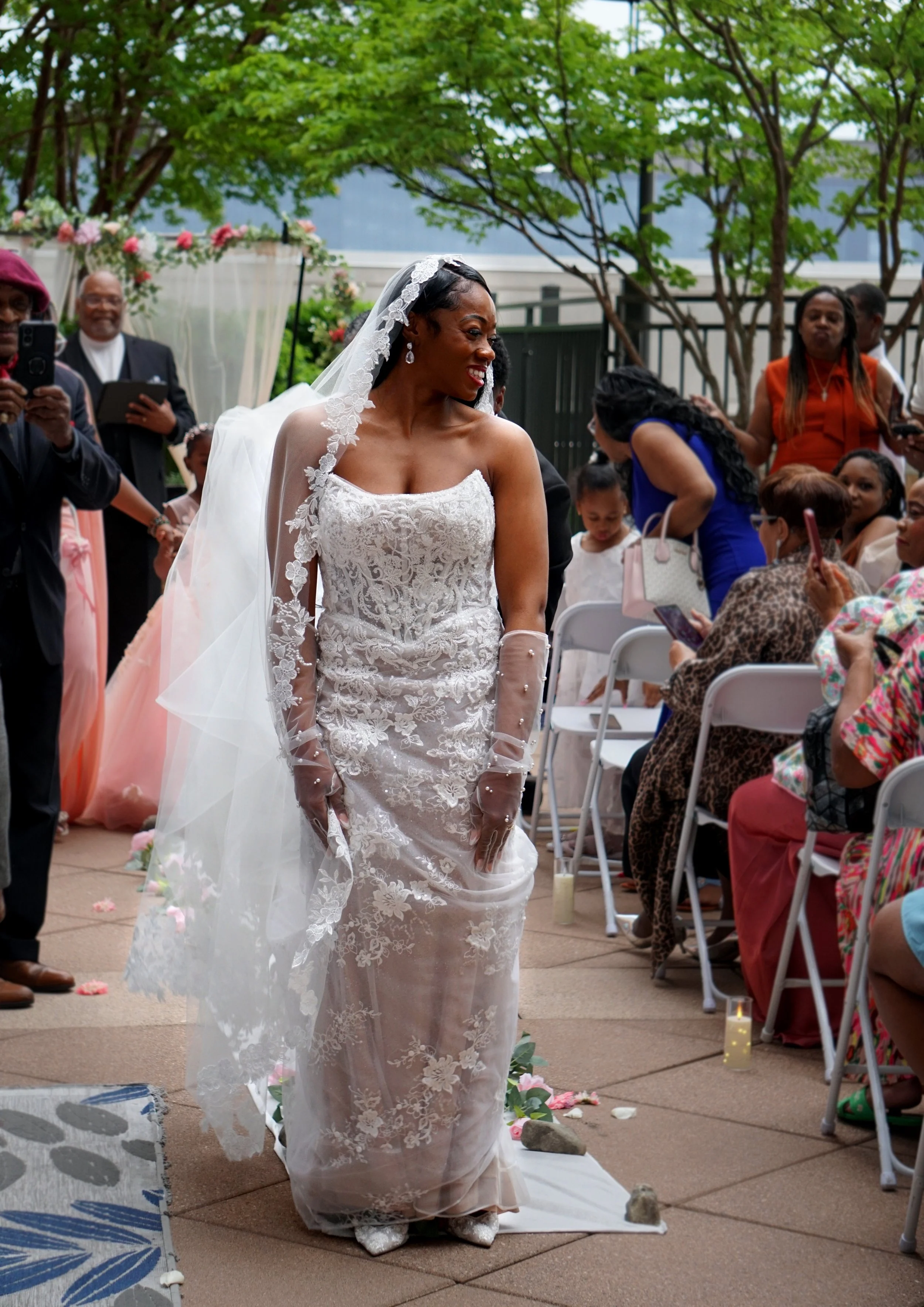 wedding photography of a bride walking down the aisle