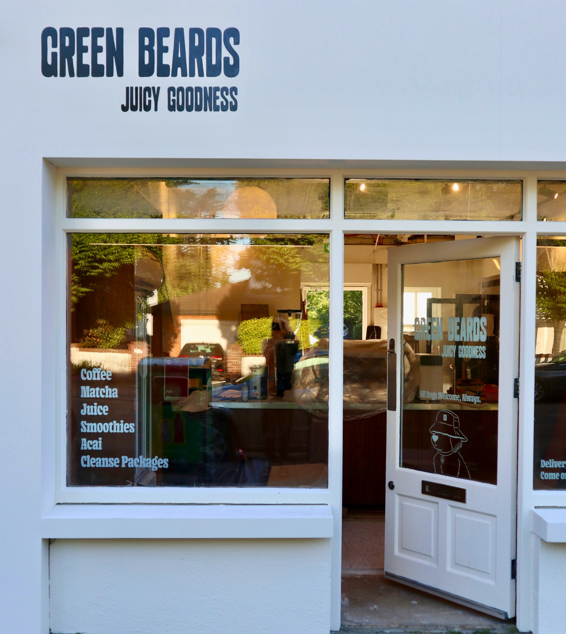 Green Beards Dublin storefront showing window signage for coffee, matcha, raw cold-pressed juice, smoothies, acai bowls, and cleanse packages.