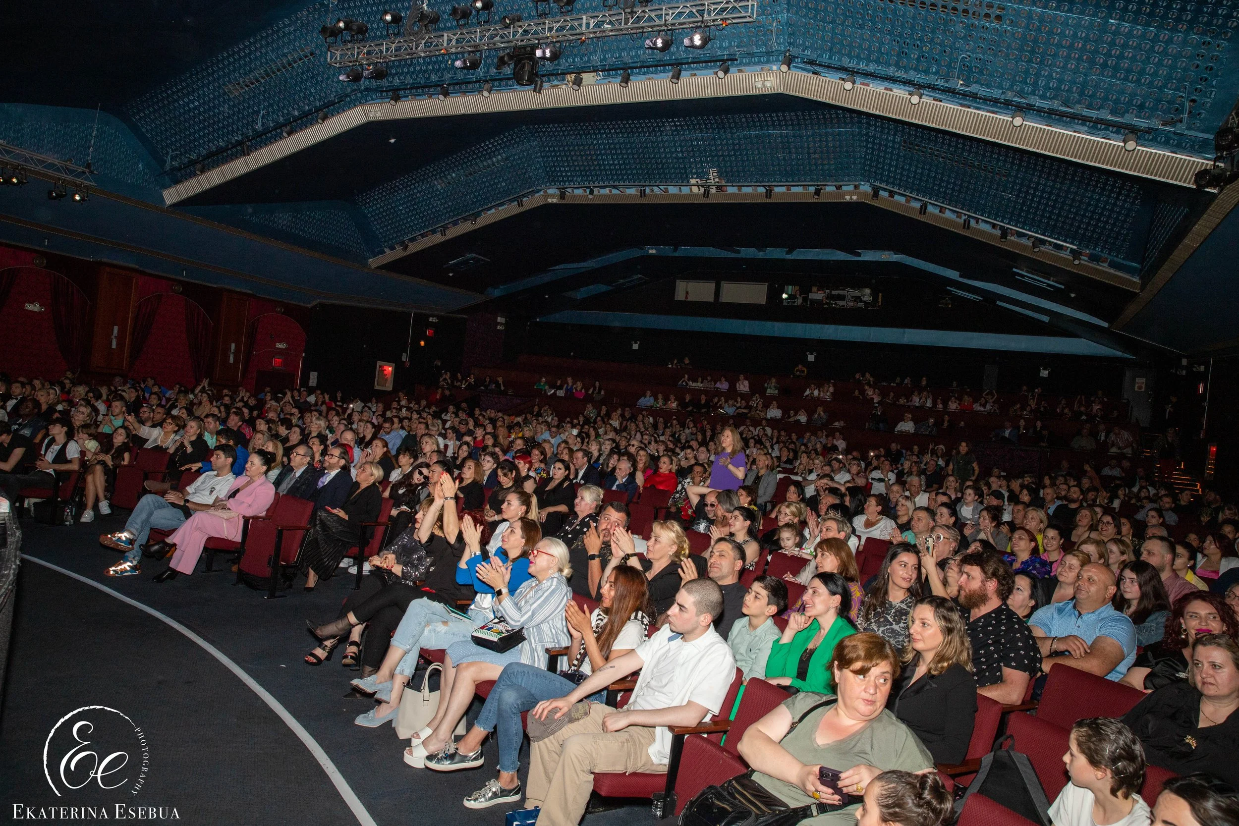 Grand theater auditorium audience and corporate summit venue photography by Ekaterina Esebua