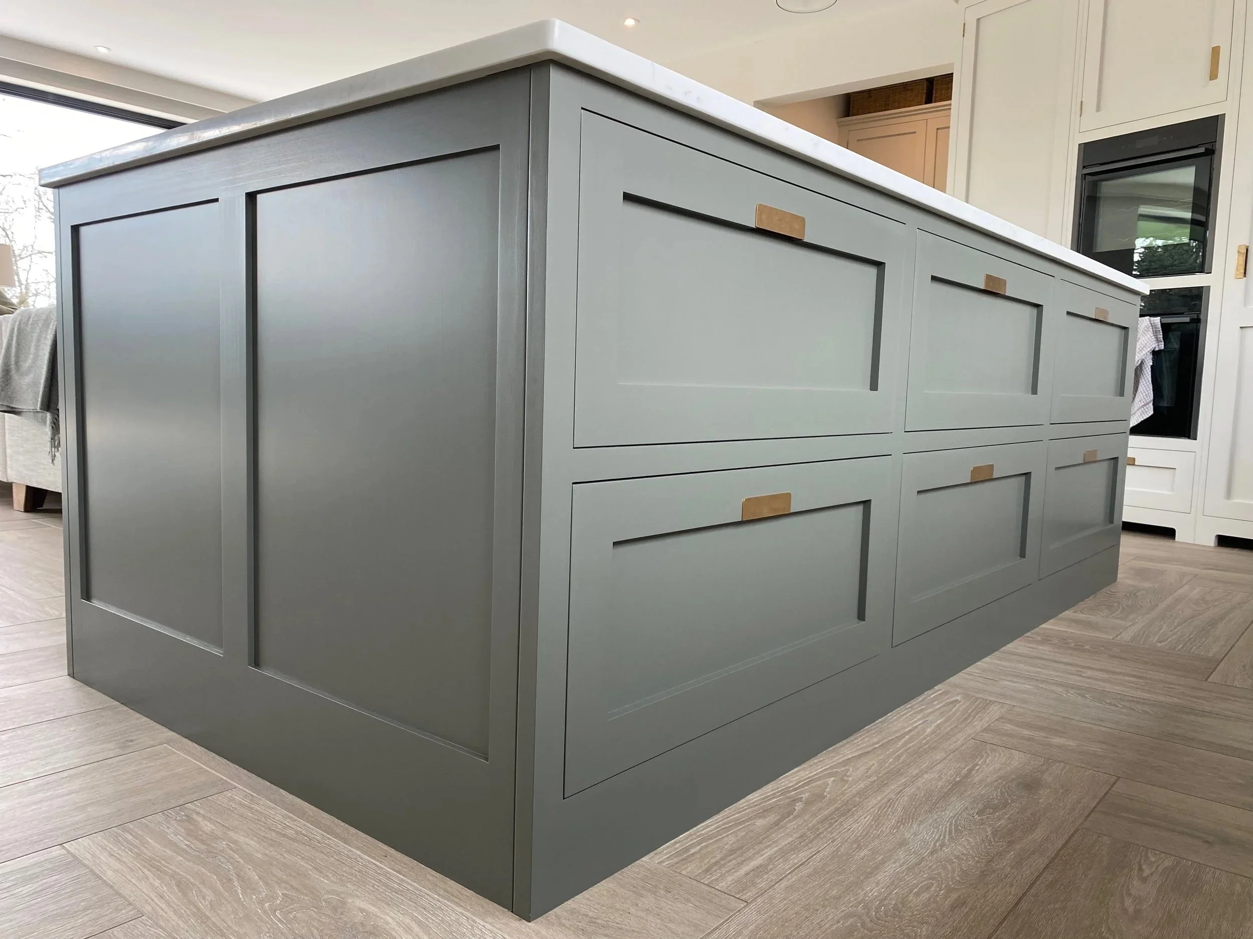 A kitchen island by Higham Furniture hand painted by Larsen Paint Finishes in Little Greene 'Livid'