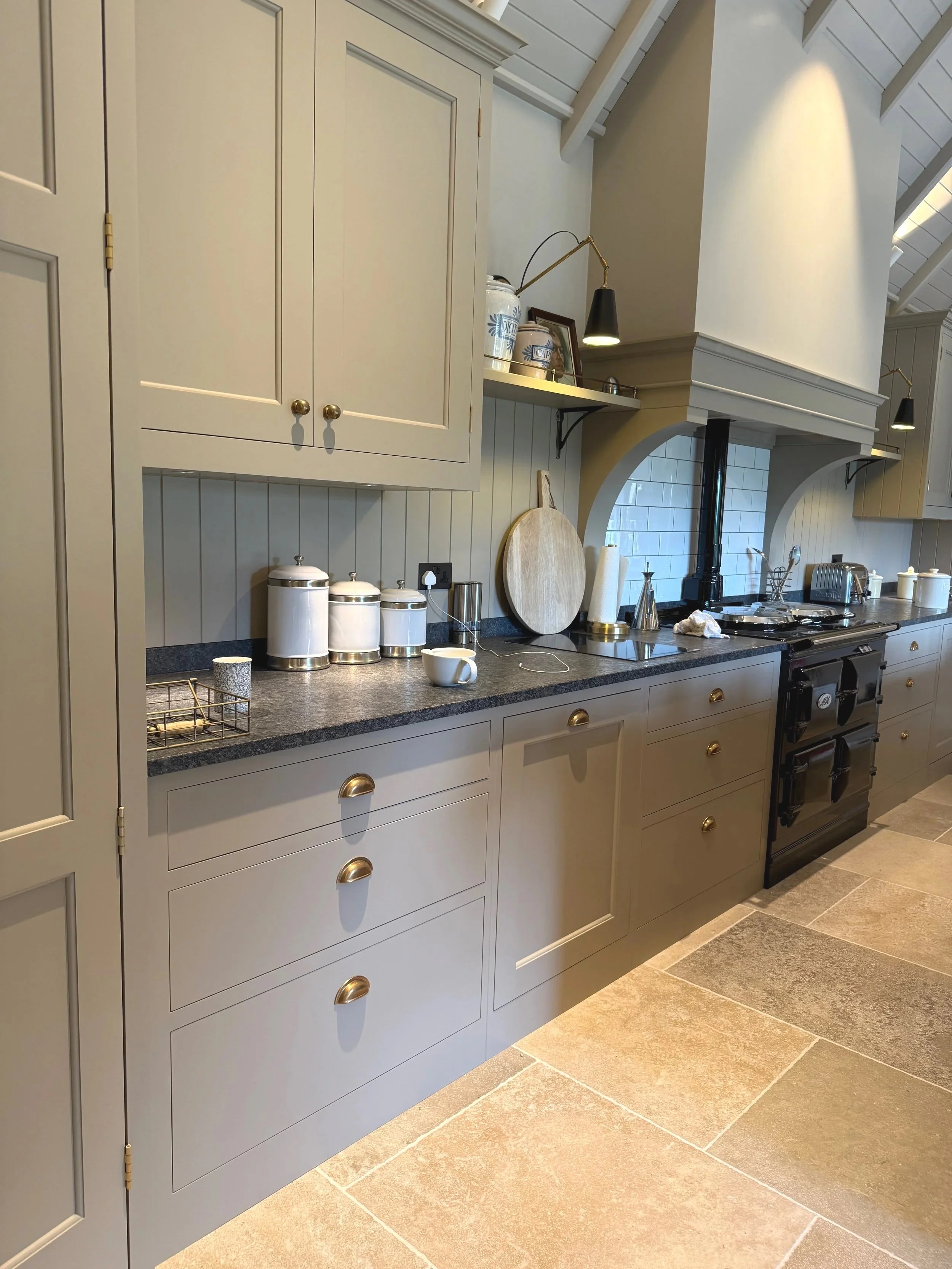 A stunning Higham Furniture kitchen in Haslemere hand painted in Little Greene 'Portland Stone' by Larsen Paint Finishes