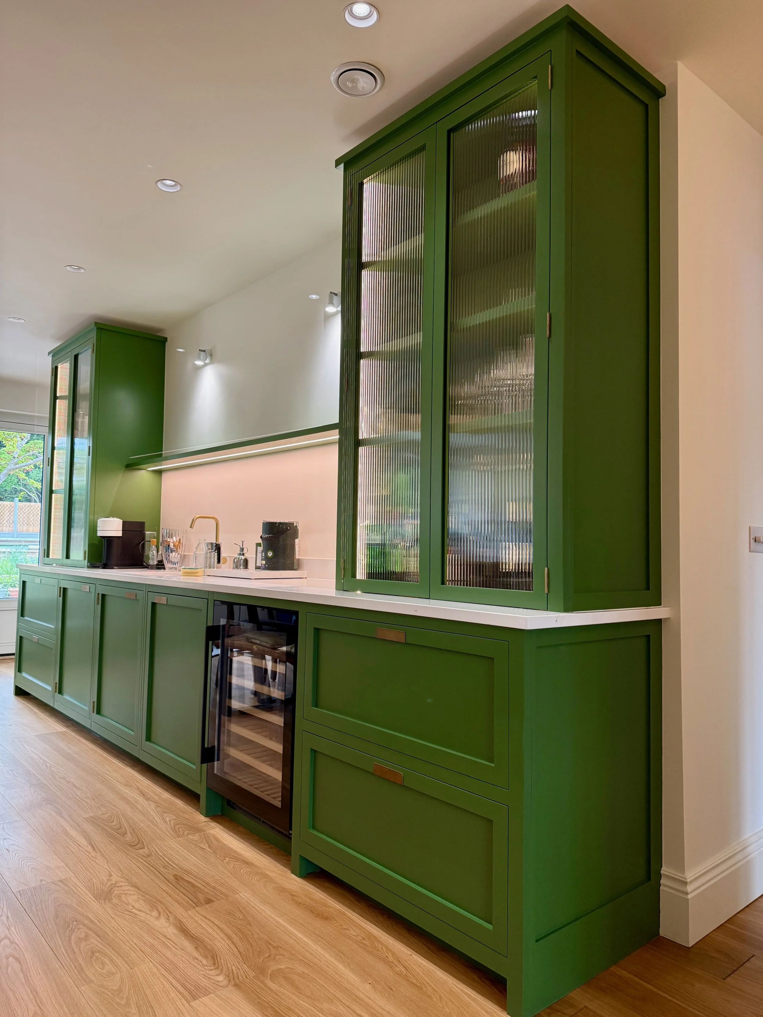 A stunning vibrant bar area  by Higham Furniture in Sutton hand painted in Little Greene 'Hopper'