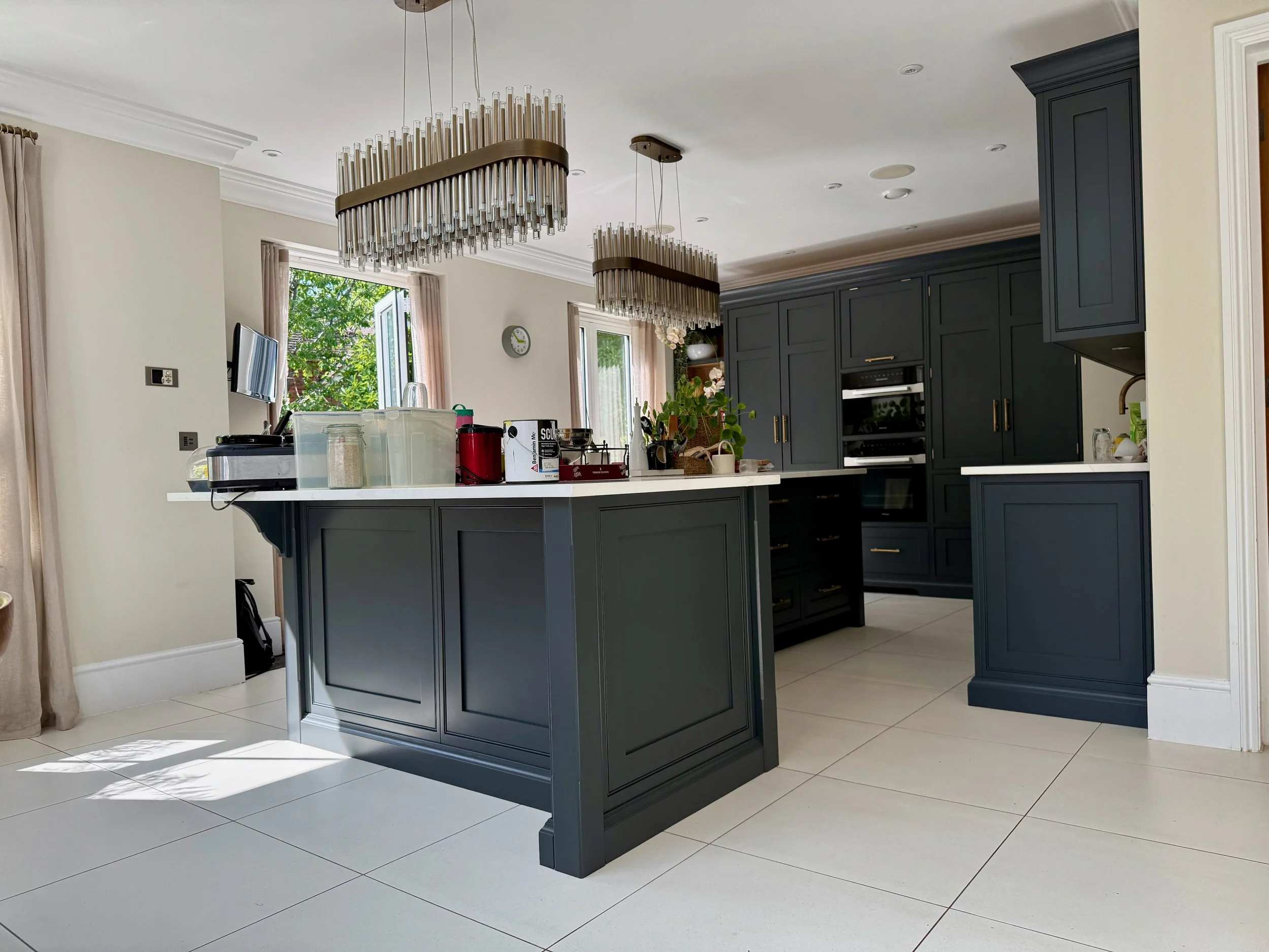 A stunning kitchen by Cutler & Berry hand painted in Pompeian Ash by Little Green in Thames Ditton