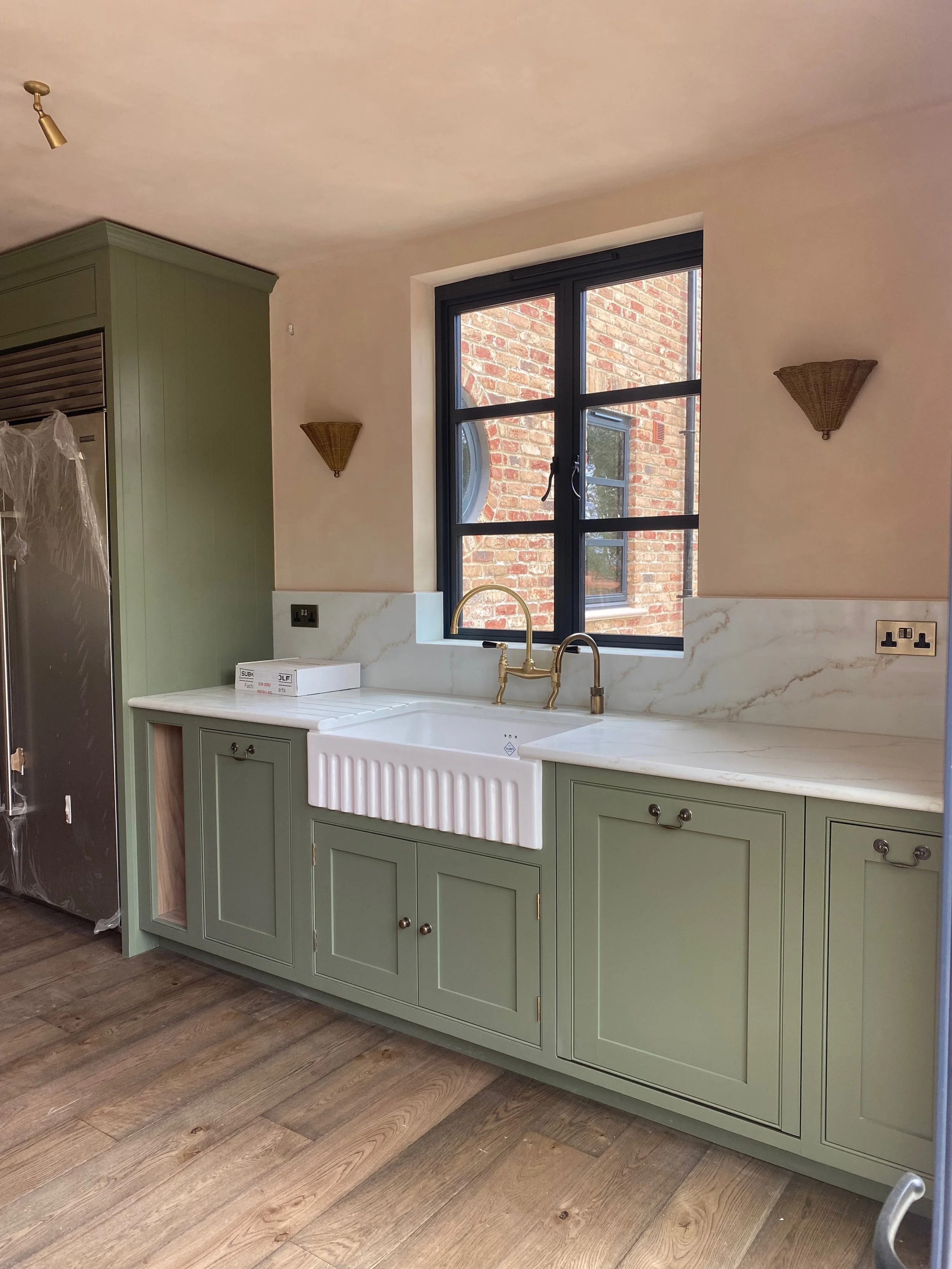 A Handmade Kitchens of Christchurch hand painted by Larsen Paint Finishes in Farrow & Ball 'Card Room Green, equivalent in Tikkurila Intact 8 in Haselmere, Surrey 