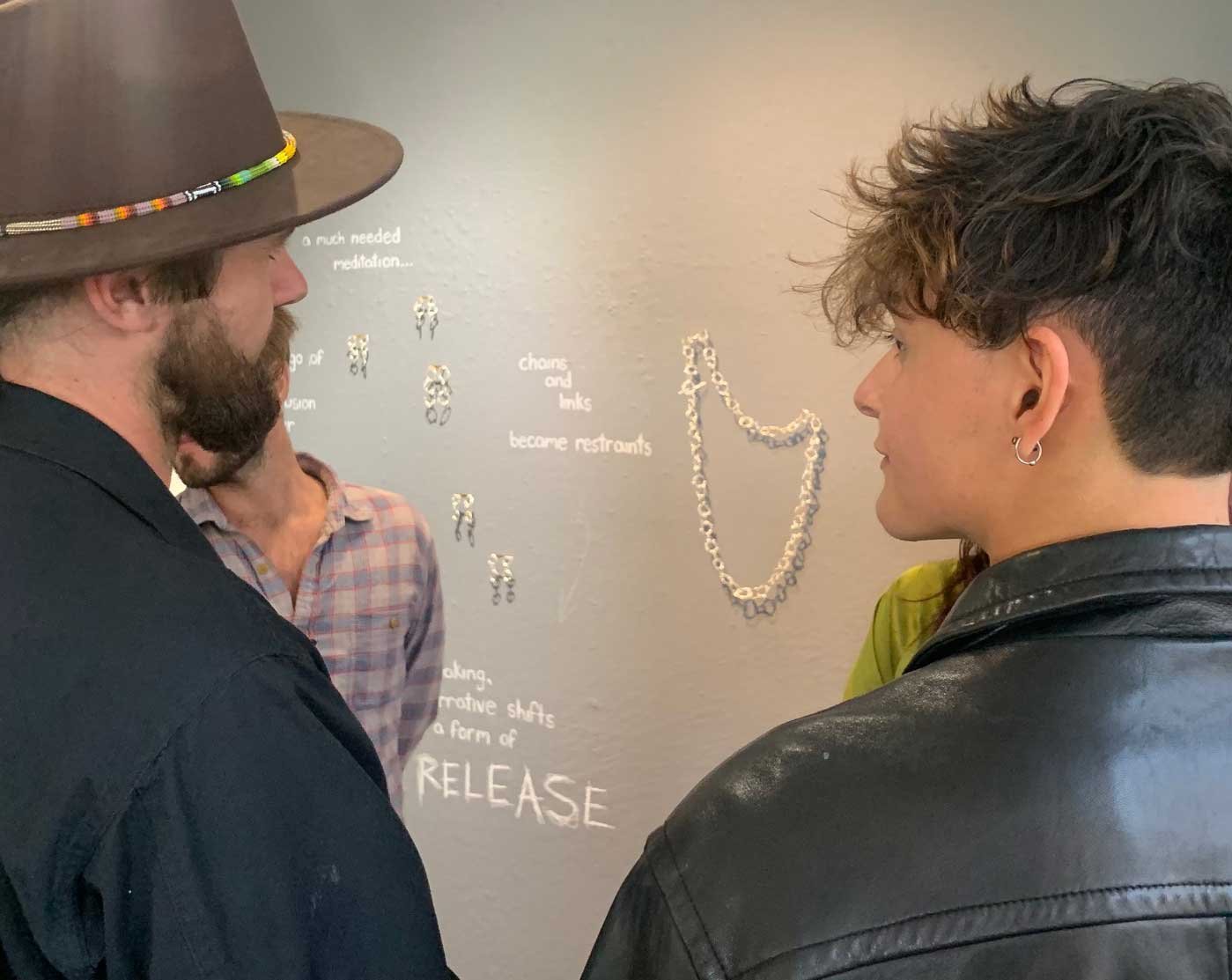 2 young people appreciating an exhibit at Mendocino Art Center