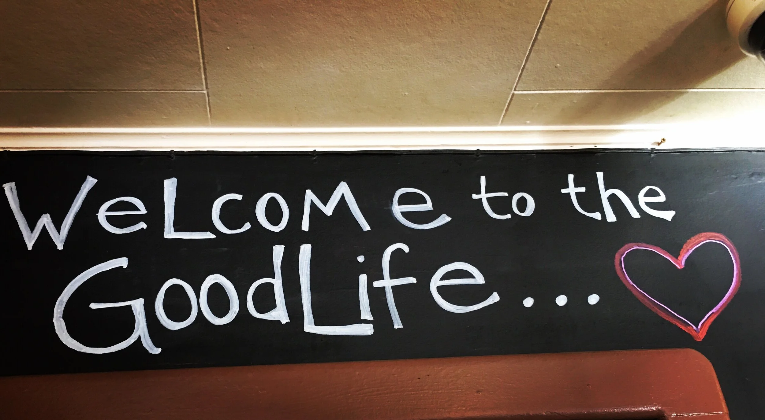 hand drawn sign "Welcome to the Good Life" at Good Life Cafe & Bakery in Mendocino, California