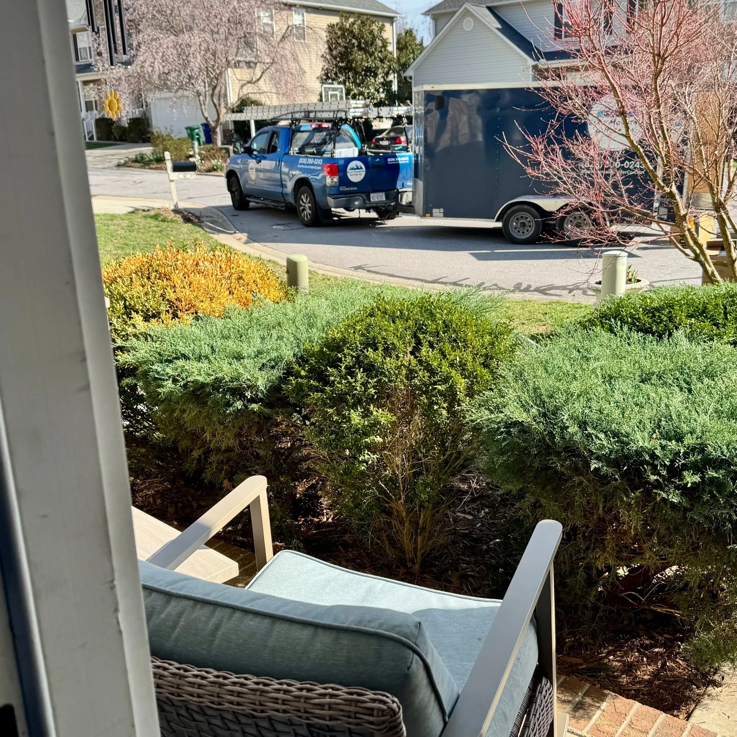 Seamless gutter truck, trailer, and machine arriving for an installation in the Waightstill Mountain neighborhood of Arden, NC