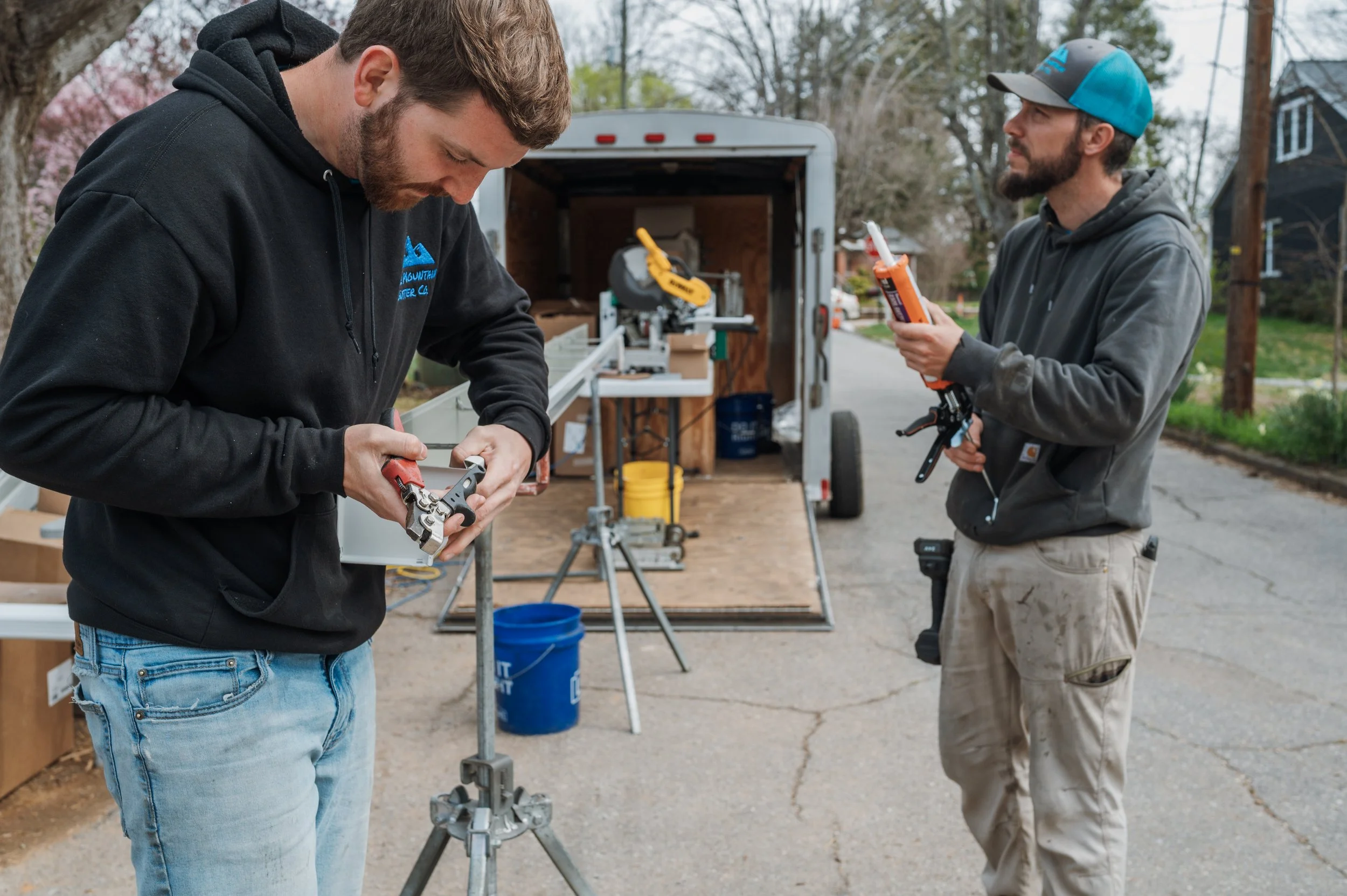 Gutter installers put together a custom fabricated seamless gutter in the Oakley neighborhood of Asheville, NC