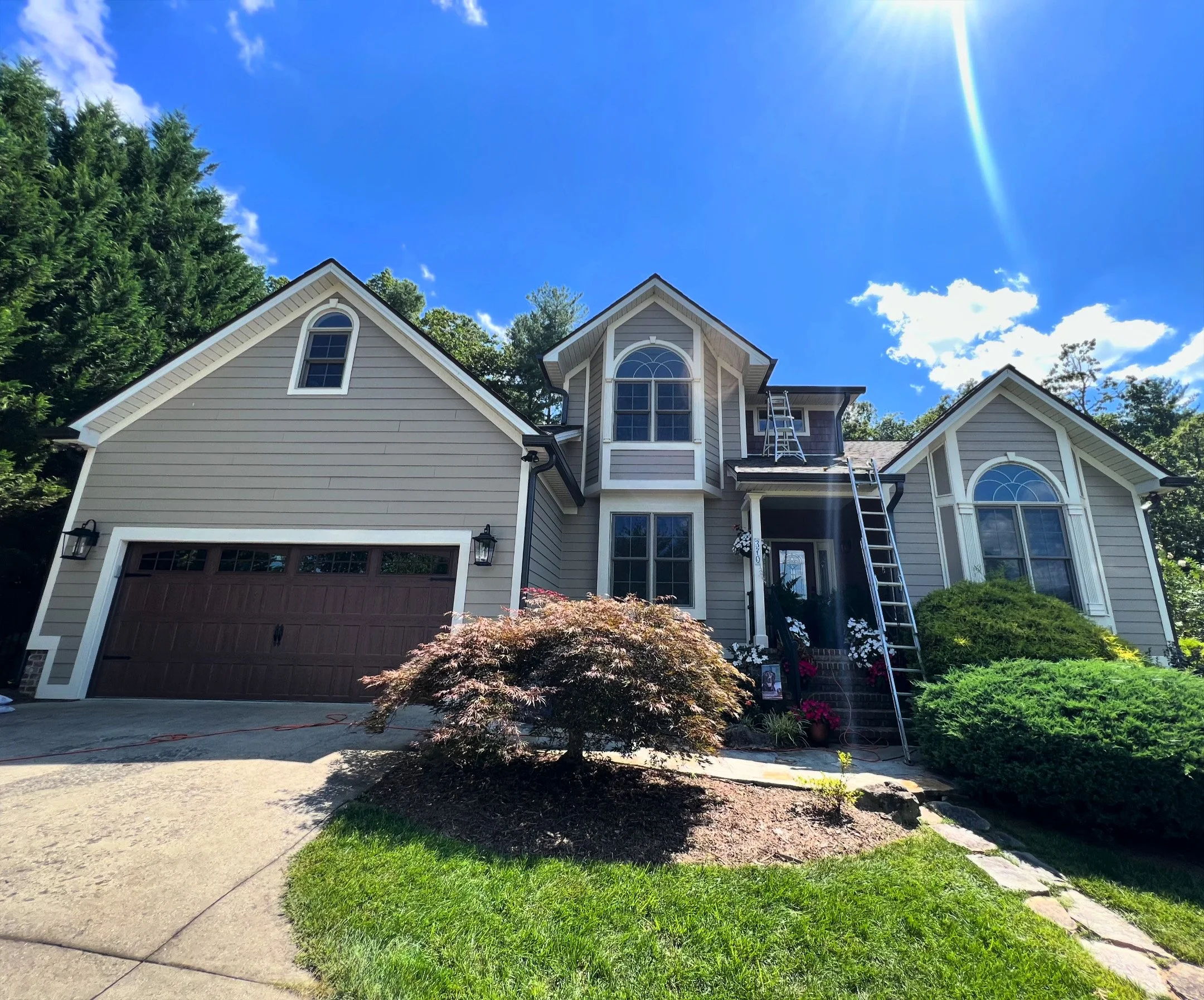 Dark Bronze seamless gutter installation in the Ashley Woods neighborhood of Arden, NC