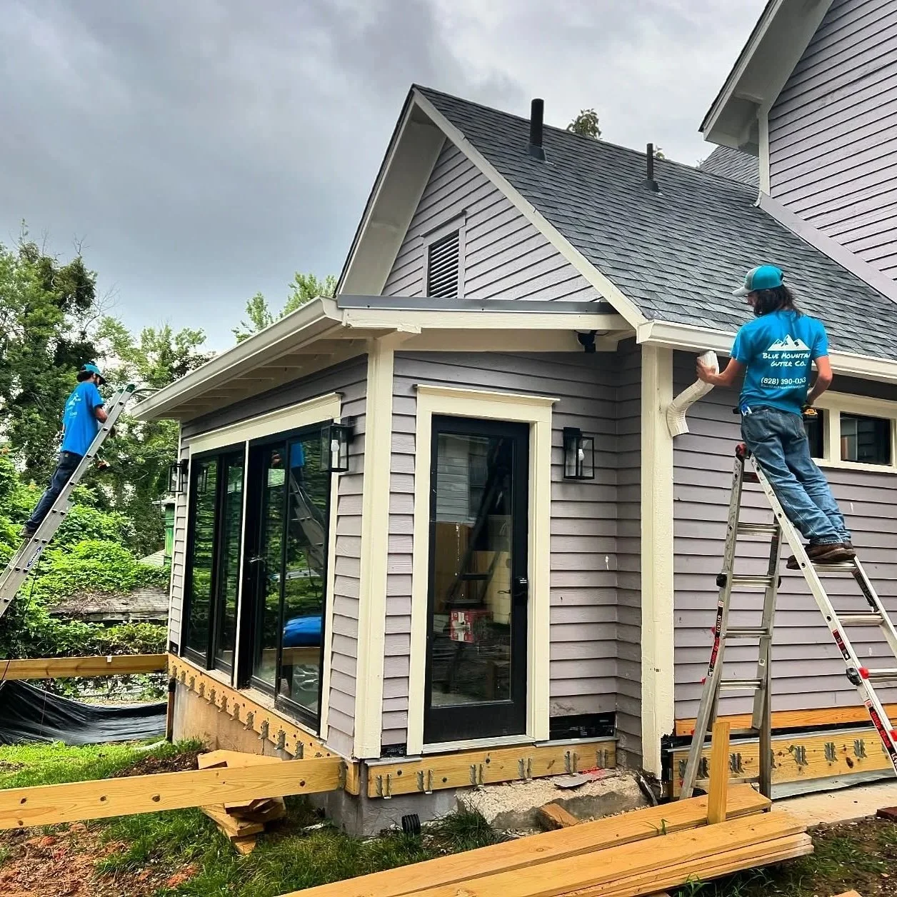 Our gutter crew preparing downspouts for installation in the Montford Historic District neighborhood of Asheville, NC