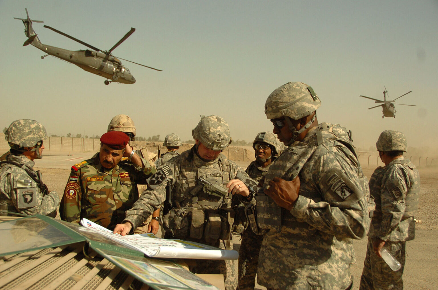  General Lloyd Austin in 2007, strategizing with U.S. and coalition officers near Baghdad, Iraq. Photo courtesy Army Spec. Nicholas Hernandez, U.S. Army via Wikimedia Commons. 