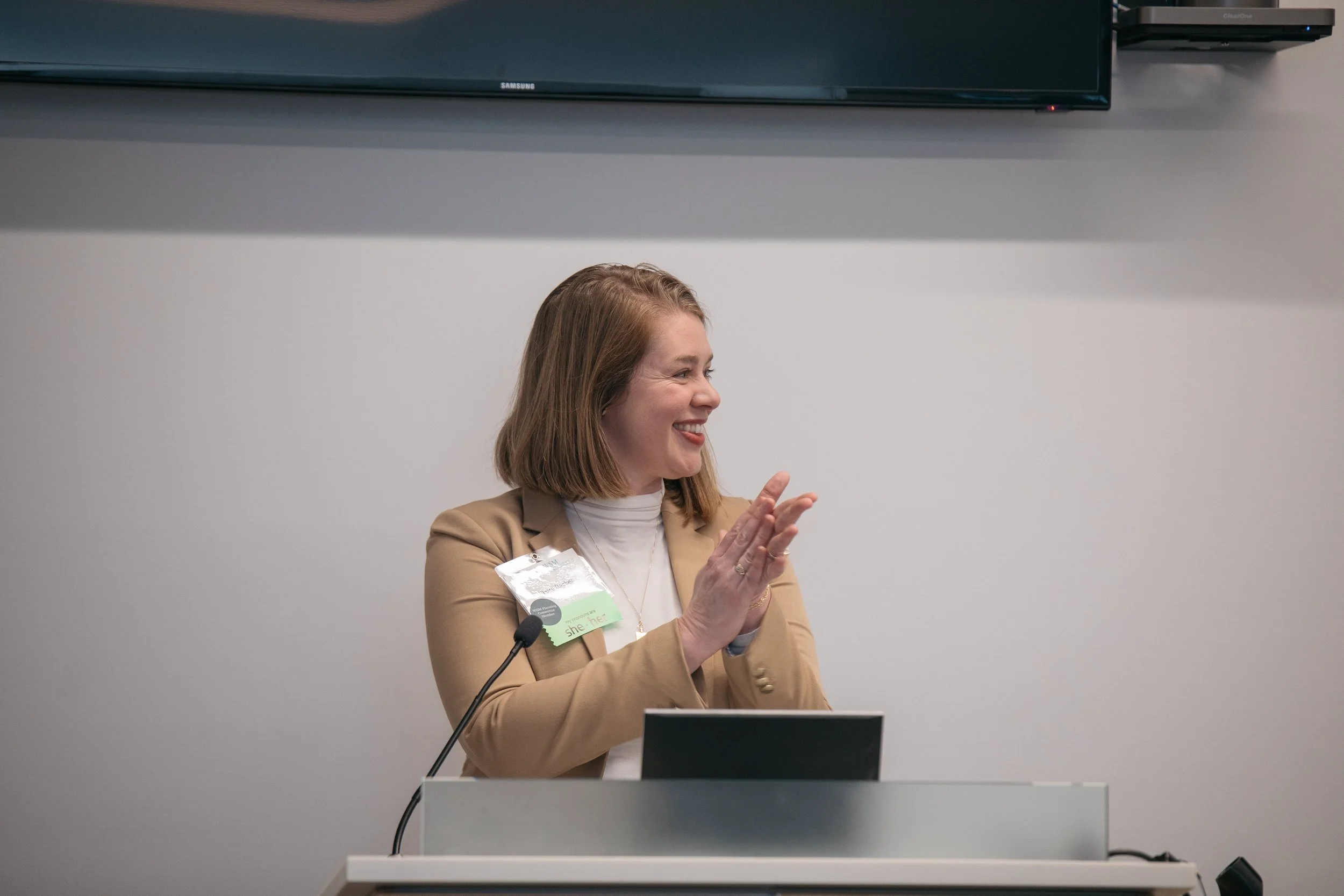 Claire Becker at Podium Applauding