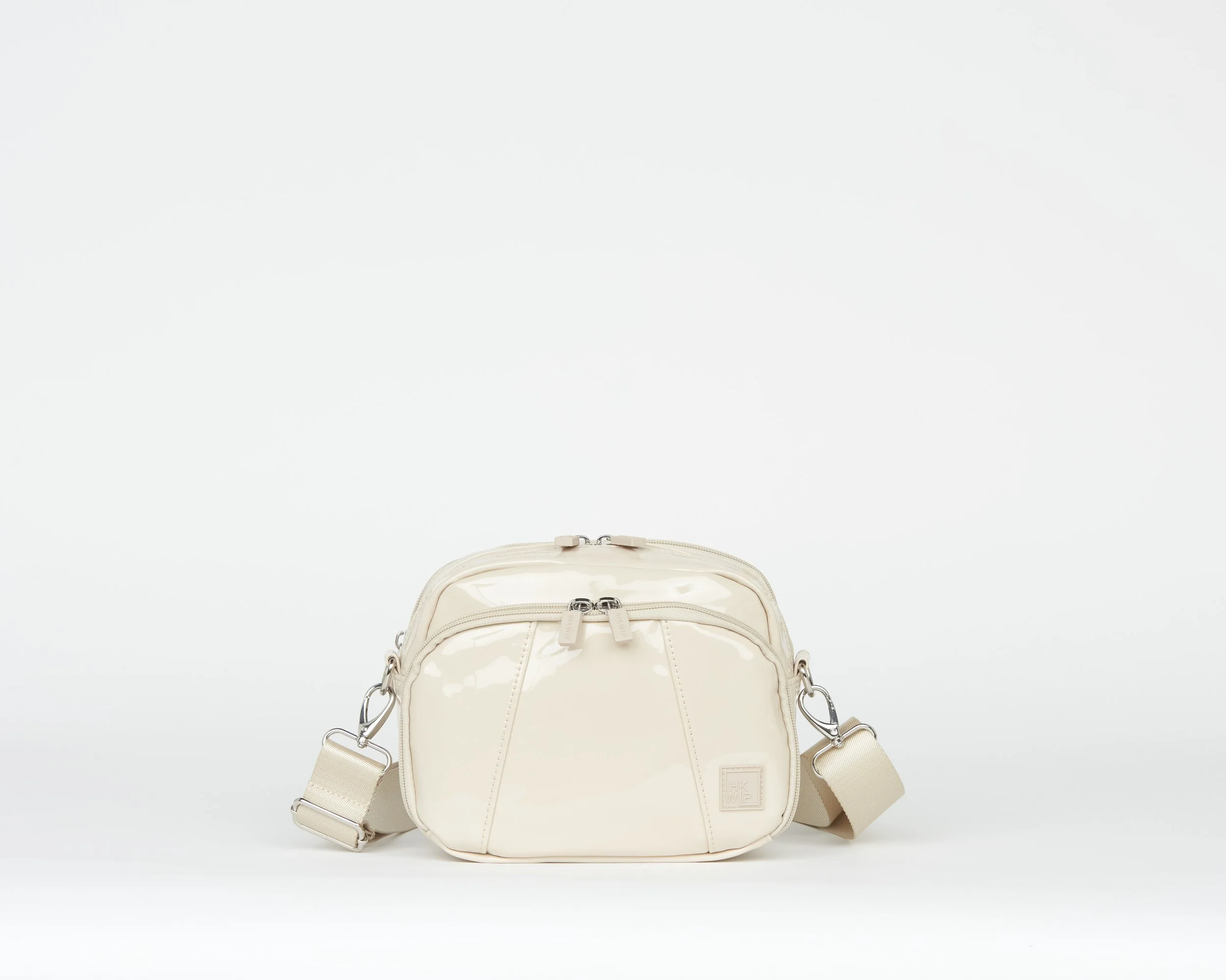 THE MODERN MOMENT CROSSBODY - PATENT SAND