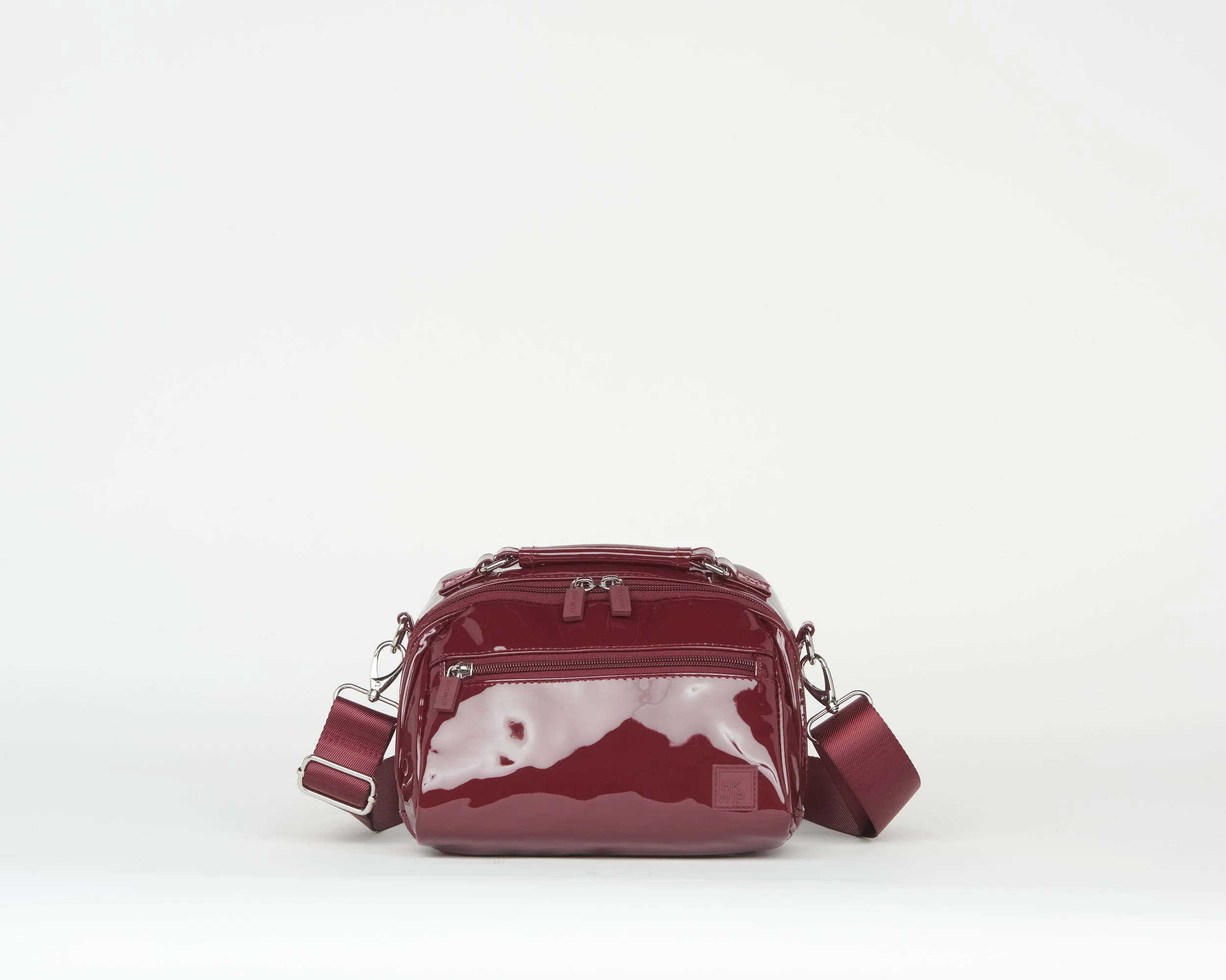 THE TOP NOTCH TOP HANDLE CROSSBODY - PATENT MERLOT