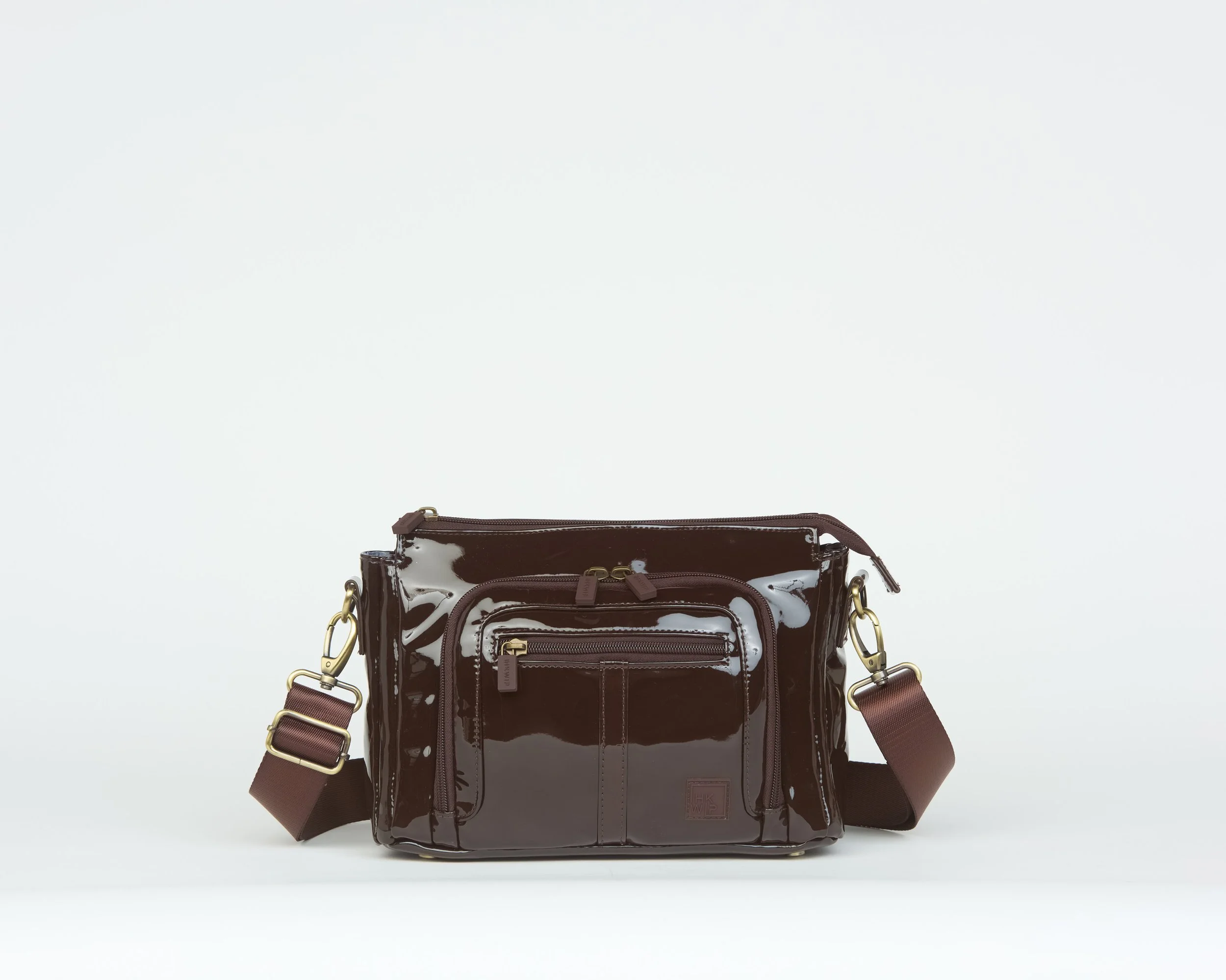 THE CONQUER THE DAY CONVERTIBLE CROSSBODY - PATENT TRUFFLE